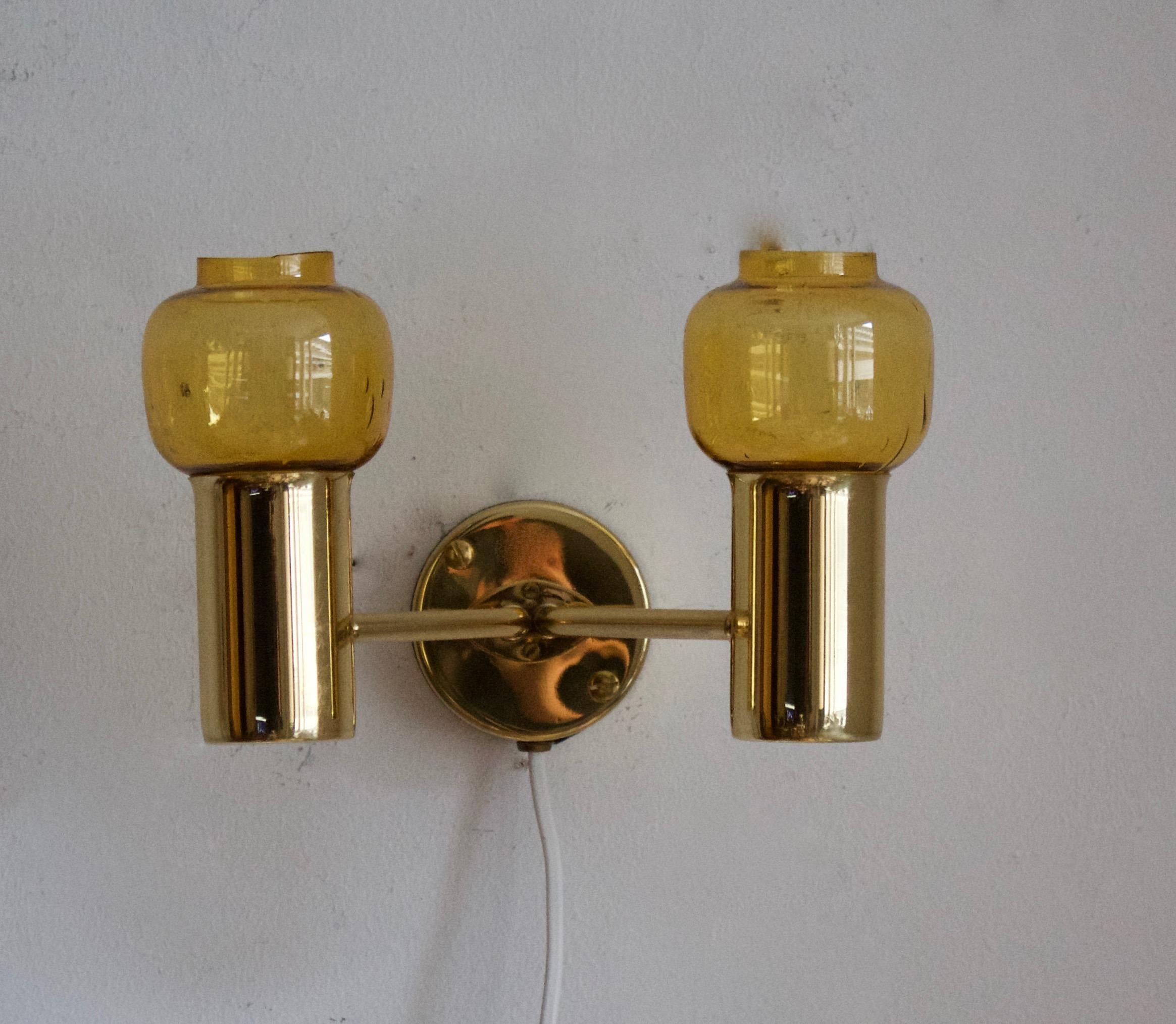 A two-armed wall light, designed by Hans-Agne Jakobsson for his own firm in Markaryd, Sweden. c. 1960s.