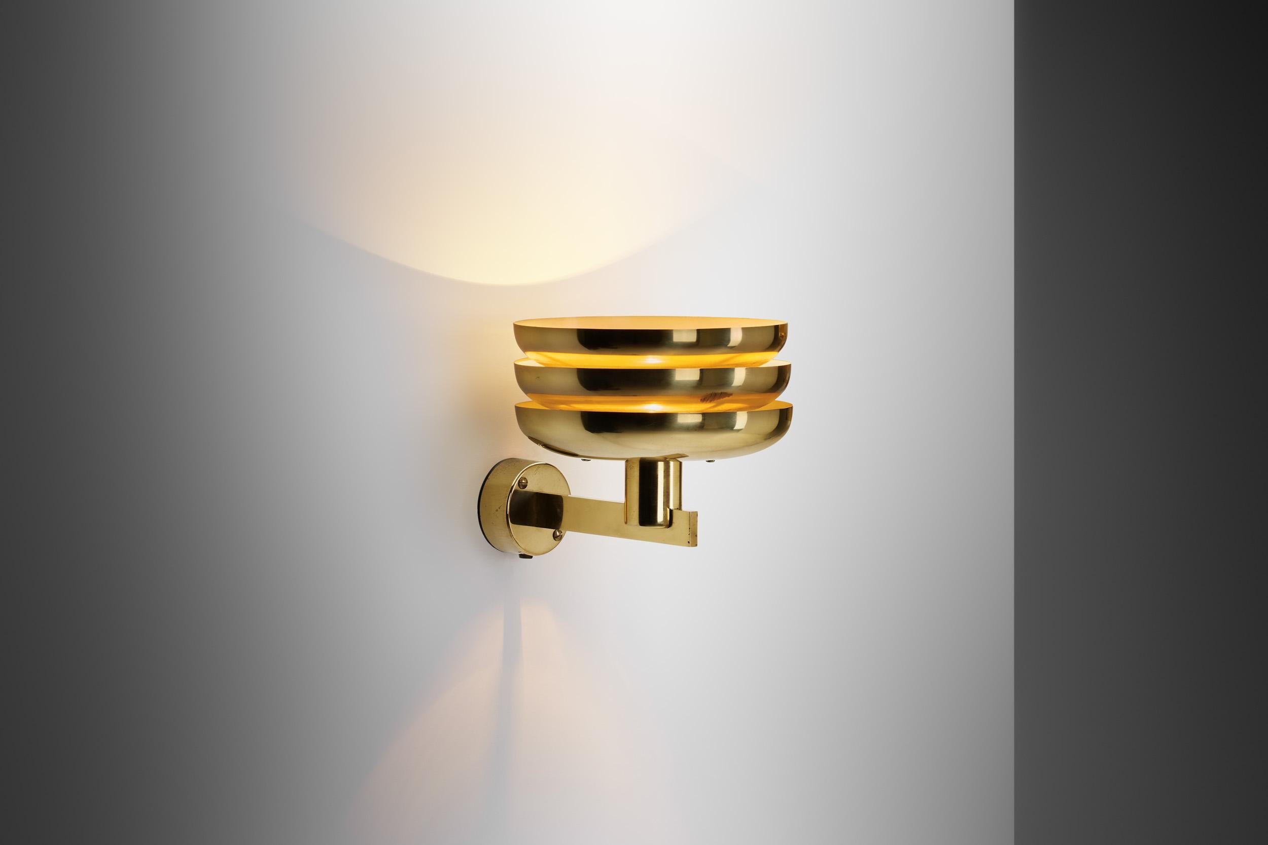 Hans-Agne Jakobsson's present “V361” wall light stands as exemplary pieces to the ingenuity of mid-century Swedish lighting design. Crafted in the 1950s for AB Markaryd, the luminaire encapsulates Jakobsson's profound influence on the mid-century
