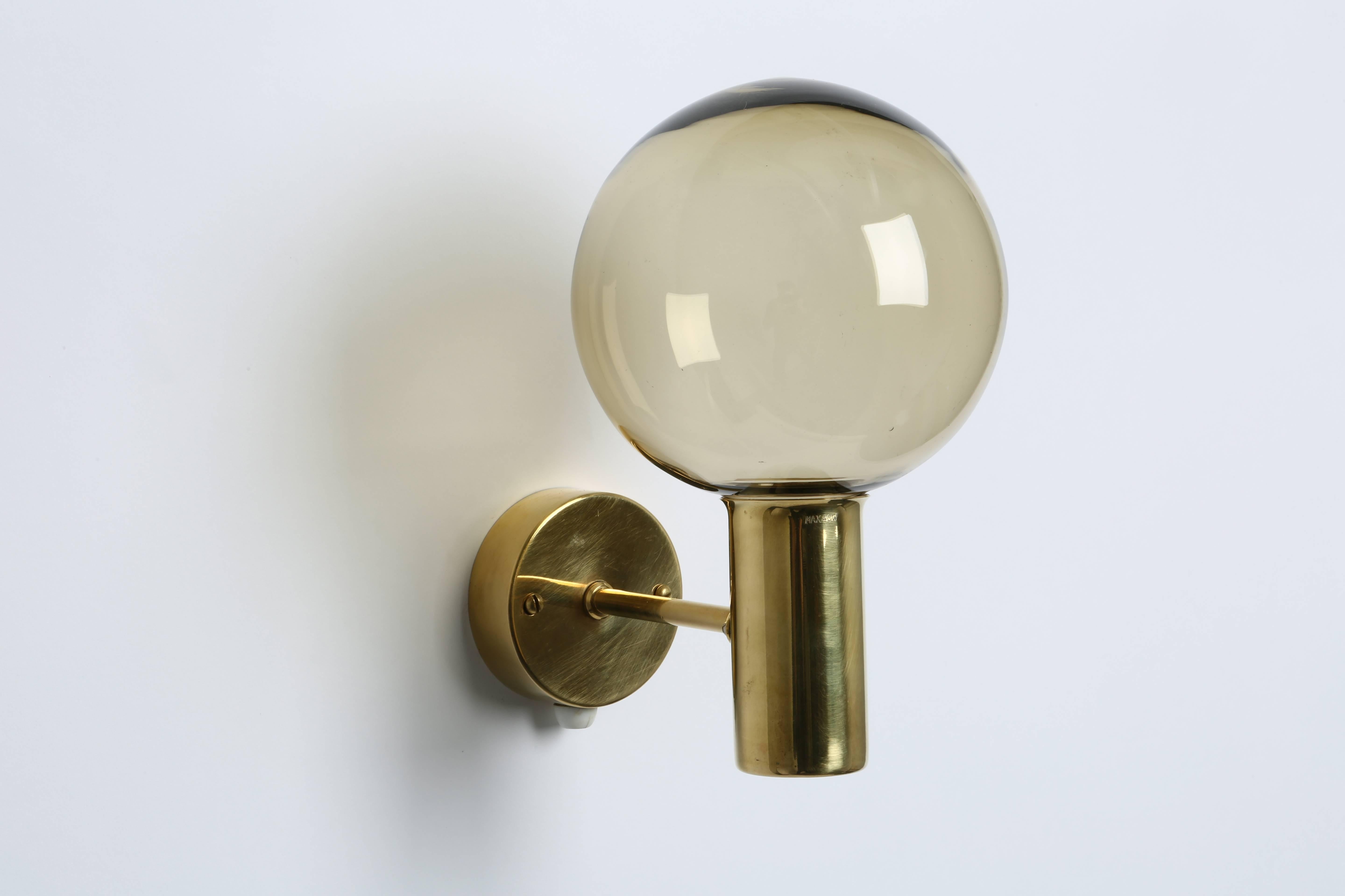 Hans-Agne Jakobsson wall lamp.
Brass and glass.
Sweden, 1960s.