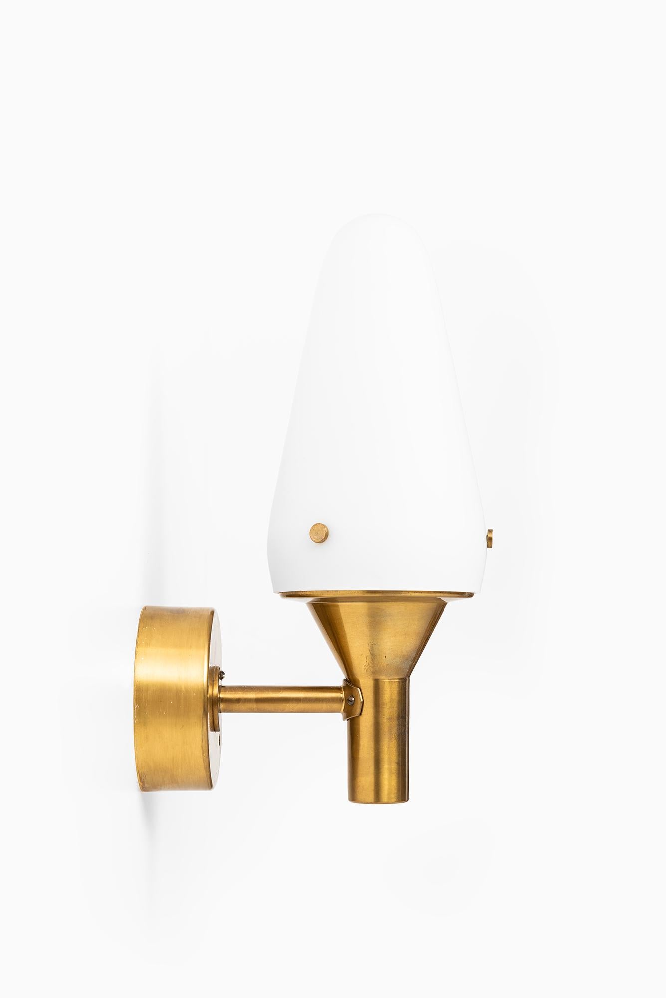 Scandinavian Modern Hans-Agne Jakobsson Wall Lamps in Brass and Opaline Glass For Sale