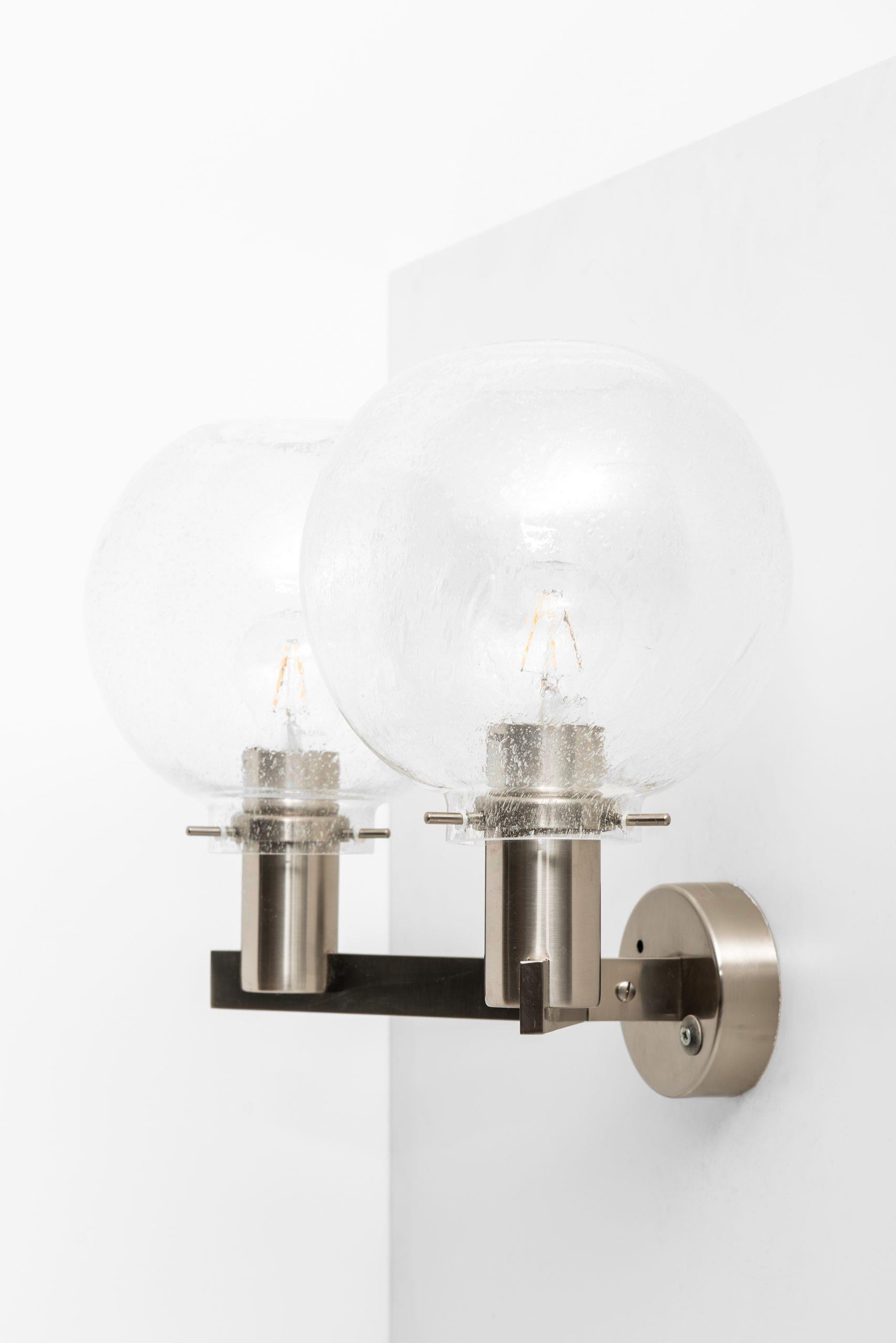 Rare wall lamps model V-305/2 designed by Hans-Agne Jakobsson. Produced by Hans-Agne Jakobsson AB in Markaryd, Sweden.
This model can also be mounted with the glass bowls down.

Listed price is / lamp.