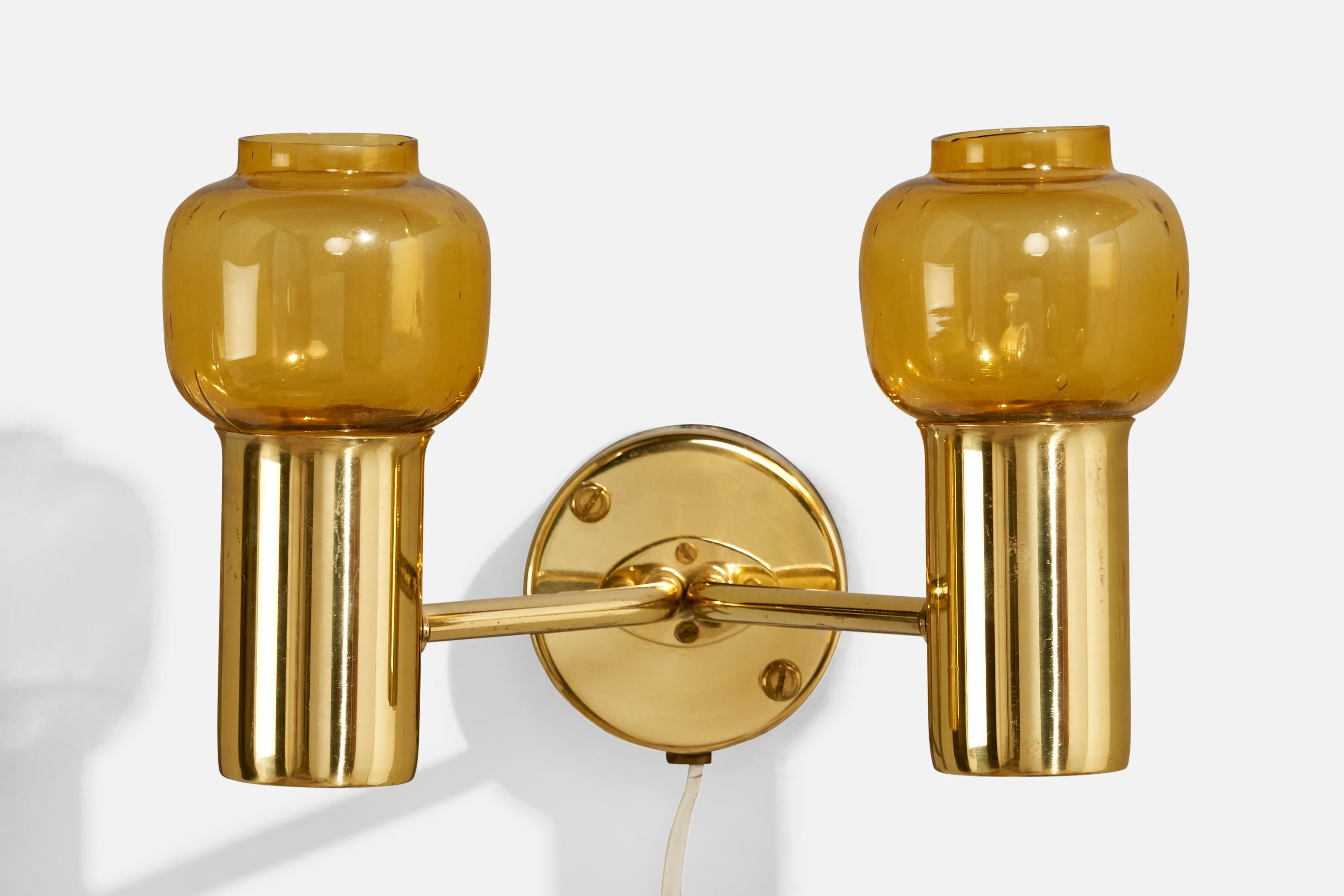 A brass and yellow-colored glass wall light designed and produced by Hans-Agne Jakobsson, Sweden, c. 1960s.

Overall Dimensions (inches):  6.5” H x  9.5” W x  8“ D

Back Plate Dimensions (Inches):  3.25” H x 3.25” W x 1.5” D

Bulb Specifications: