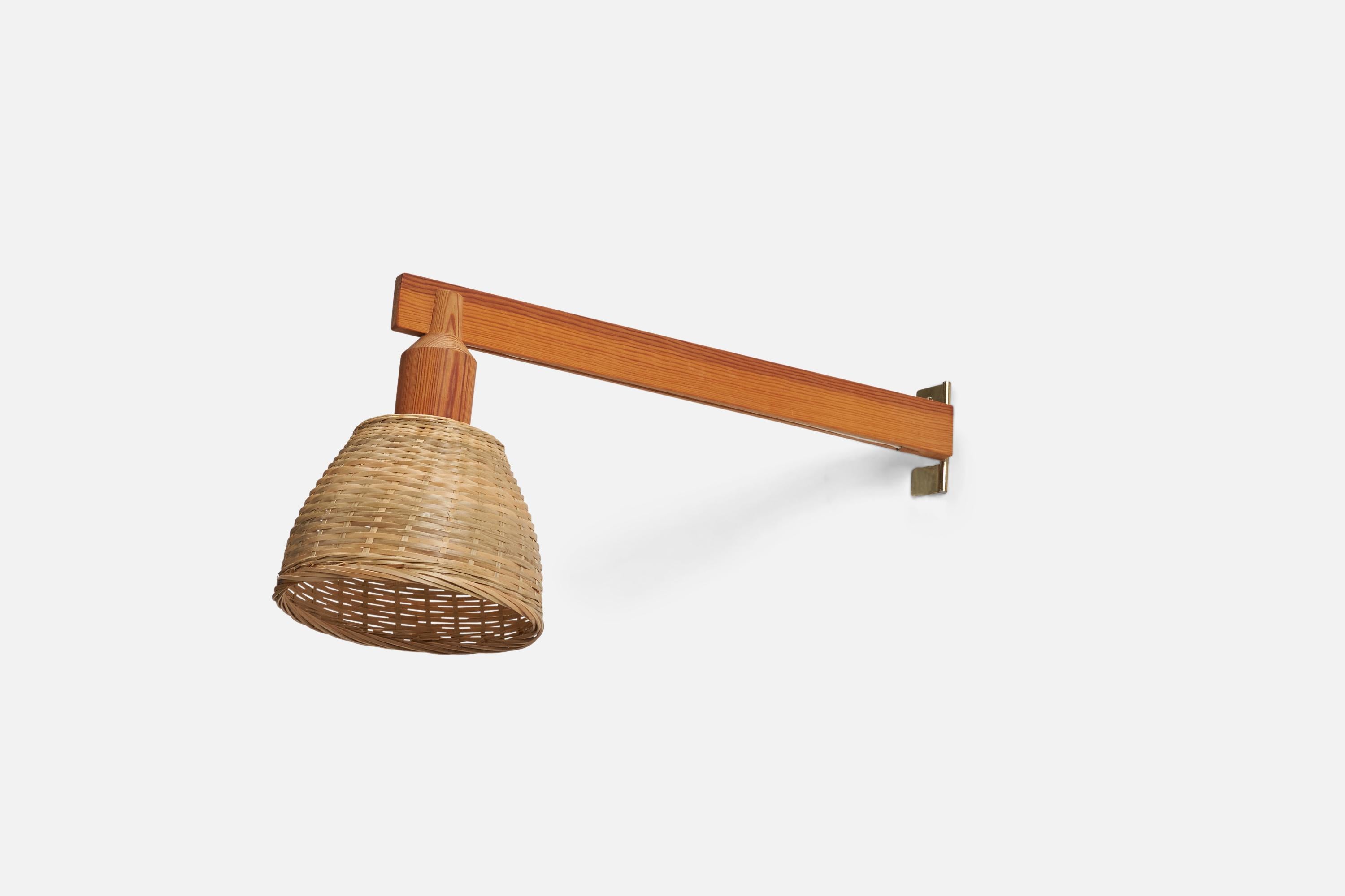 A pine and rattan wall light designed and produced by Hans-Agne Jakobsson, Sweden, 1960s.

Please note light is configured for plug in, with cord running from stem close to backplate.

Dimensions of Back Plate (inches) : 3.5 x 1.2 x 0.2 (height