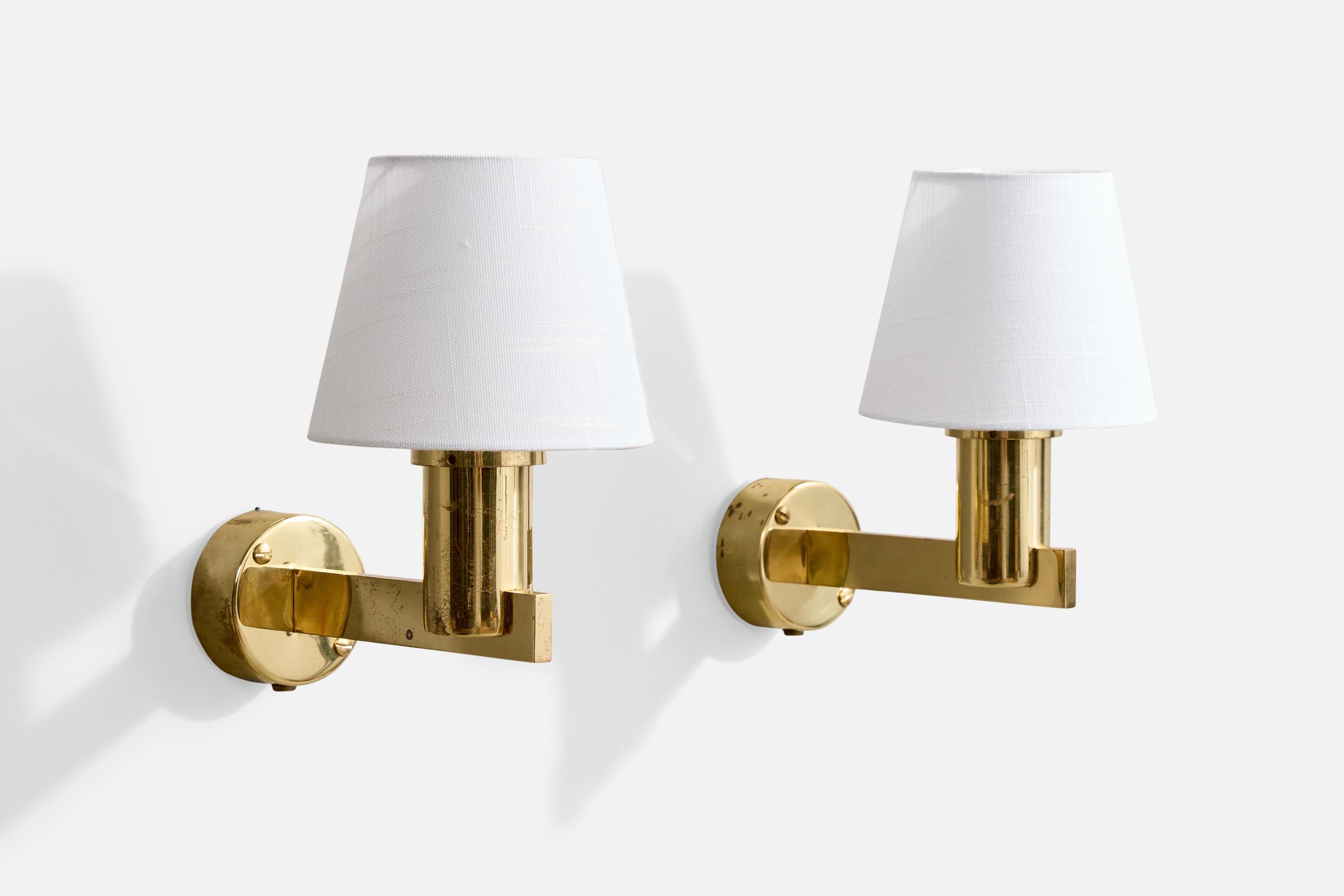 A pair of brass and white fabric wall lights designed and produced by Hans-Agne Jakobsson, Markaryd, Sweden, c. 1960s.

Overall Dimensions (Inches): 10.0