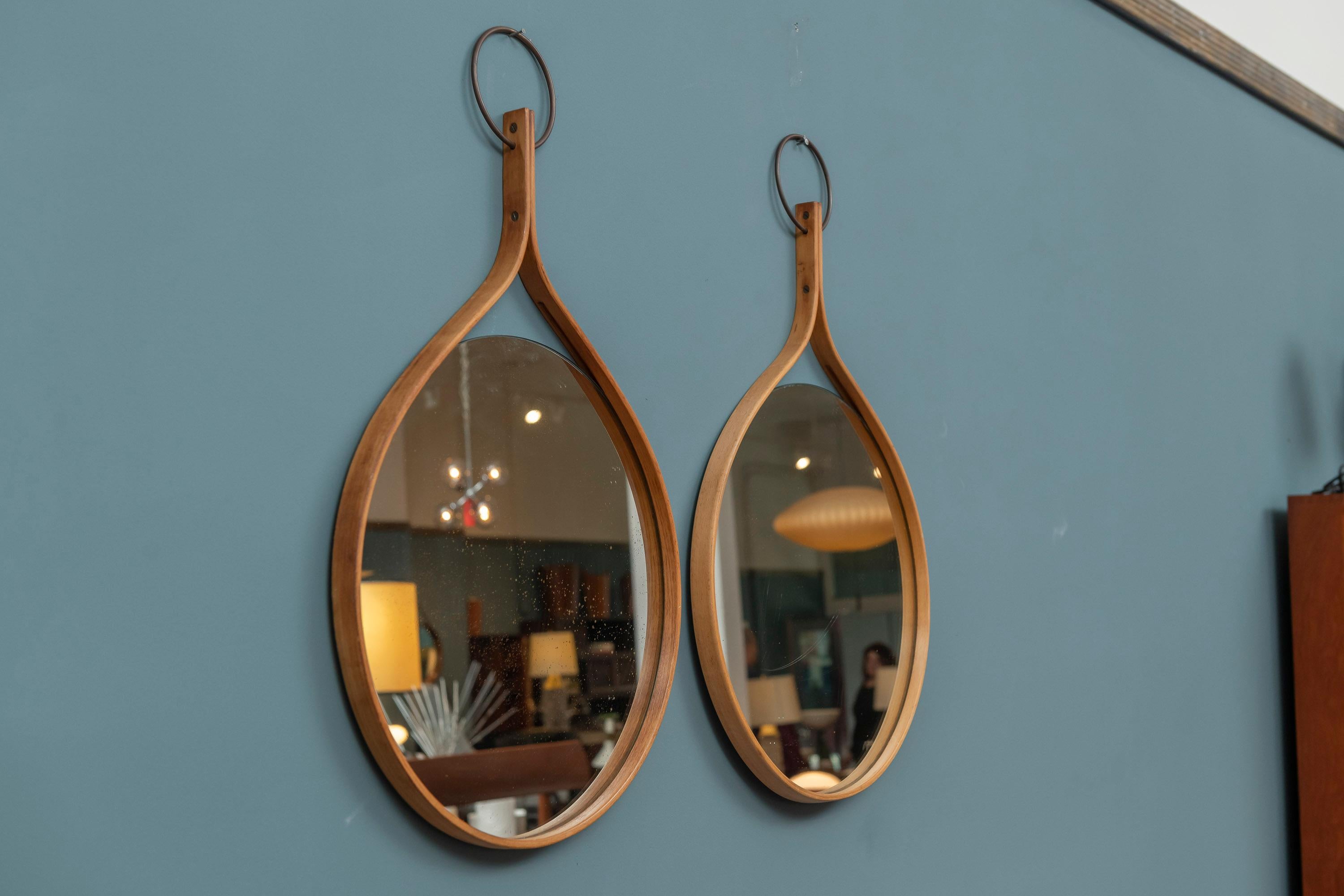 Pair of Hans-Agne Jakobsson wall mirrors, circa 1955. A beautiful bentwood design in good original condition.
  