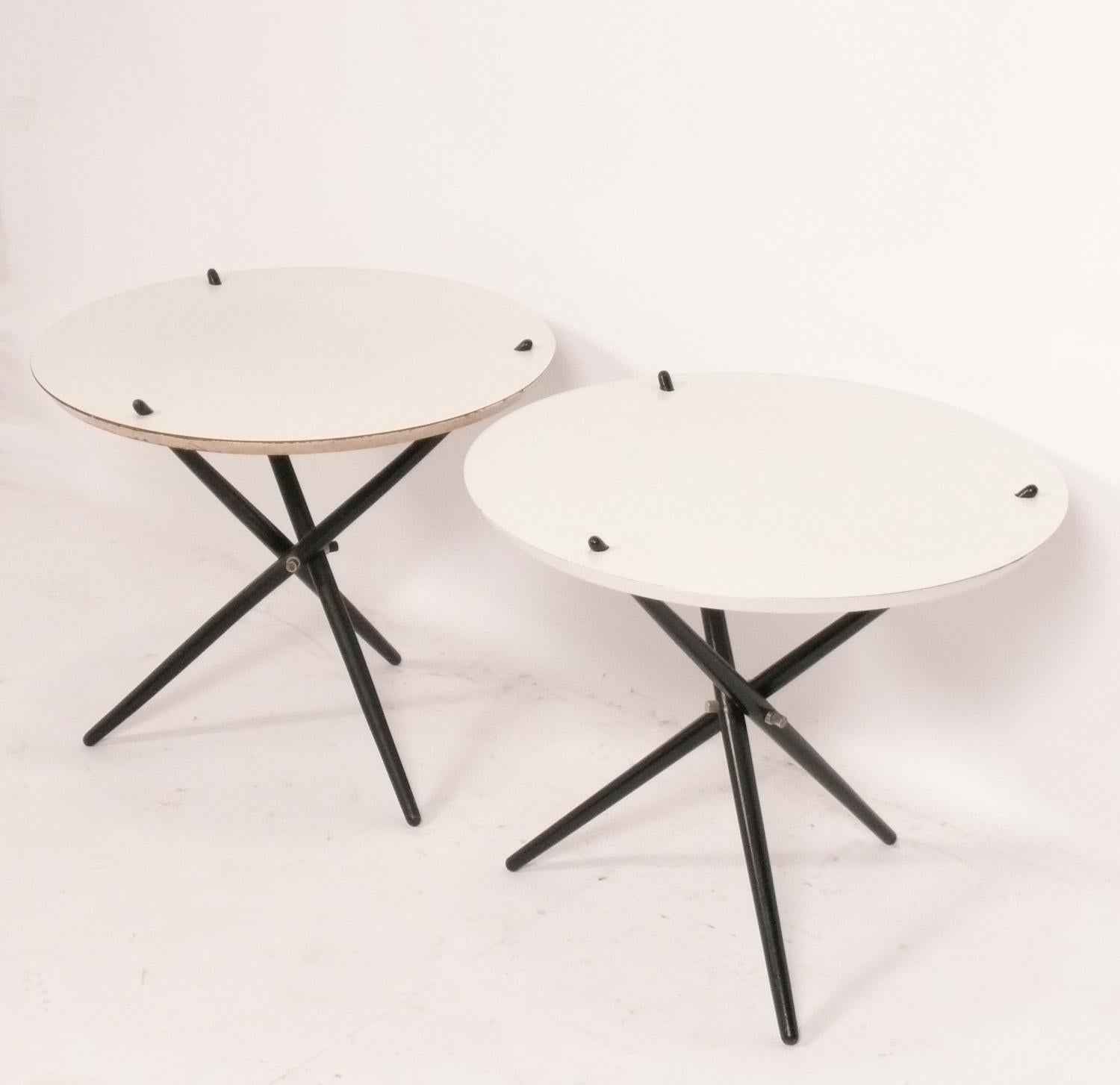 Sculptural Tripod Tables, designed by Hans Bellmann for Knoll, American, circa 1960s. They are a versatile size and can be used as side or end tables, or as nightstands. Low maintenance white laminate tops with black lacquered legs.