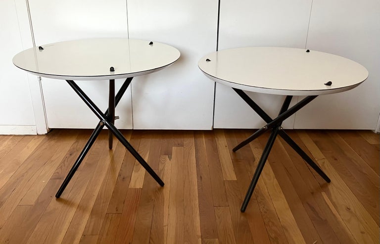Vintage pair of Hans Bellman knock-down side or occasional tables.  A great example of mid-century interest in sophisticated design in utilitarian materials to satisfy a postwar market for affordable modern design. Sculptural and with a distinct