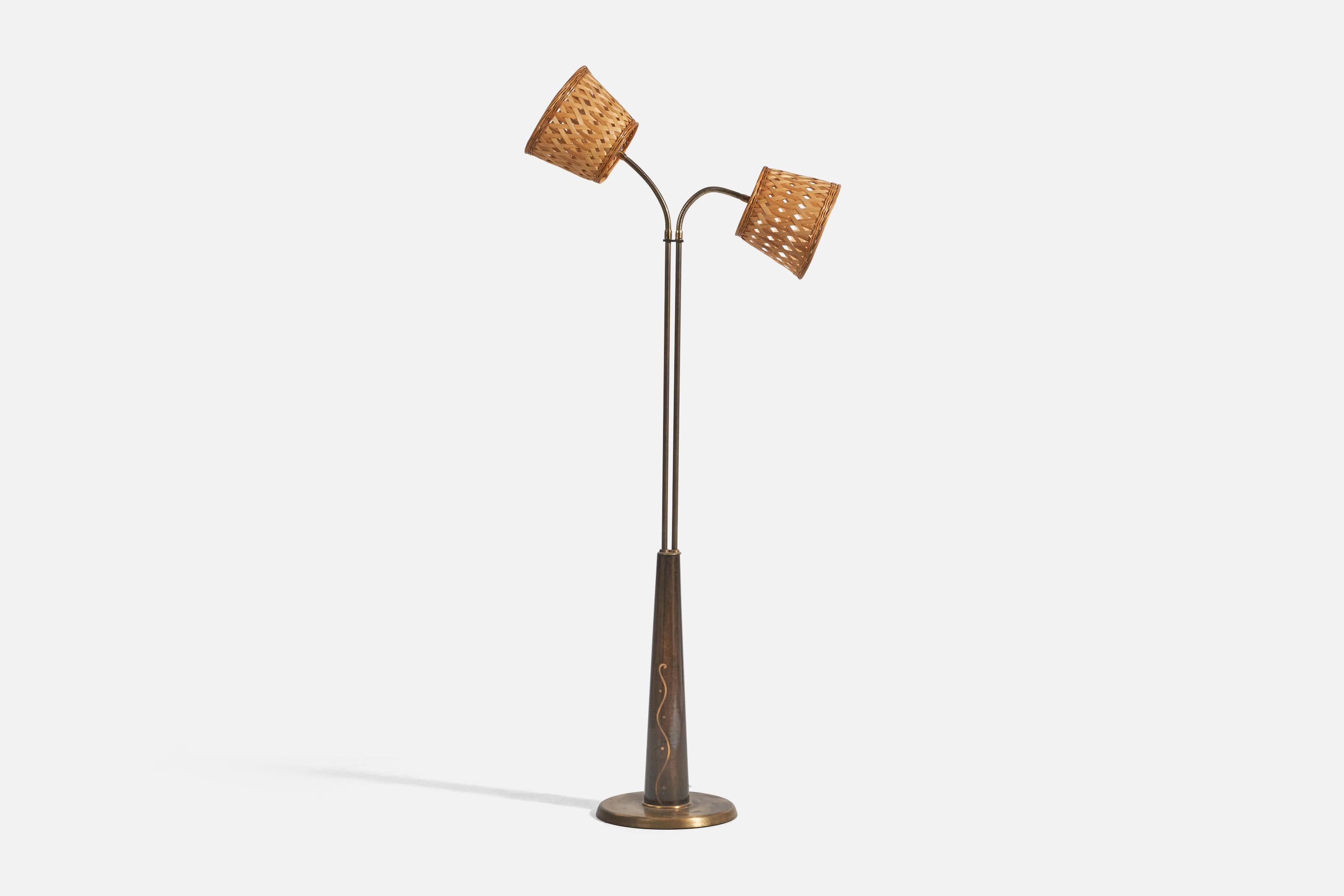 A brass, wood and rattan floor lamp; design and production attributed to Hans Bergström, Sweden, 1940s. 

Dimensions variable, measured as illustrated in first image.

Sold with Lampshades. Dimensions stated are of Floor Lamp with Lampshades.