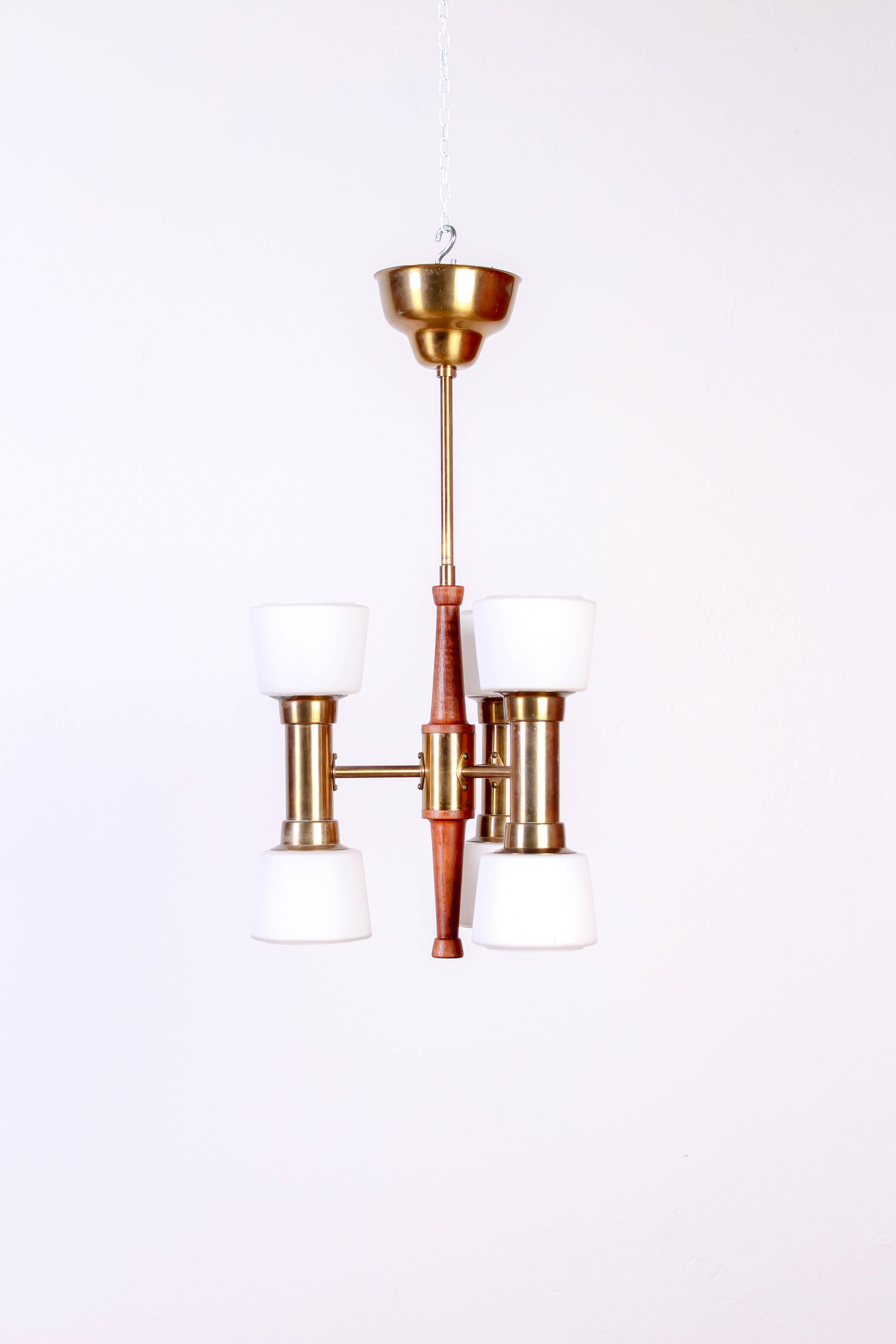 Midcentury ceiling lamp designed by Hans Bergström and produced by Swedish company ASEA. The lamp is made out of brass and teak with opaline glass shades. The lamp is in very good vintage condition with minor signs of usage.