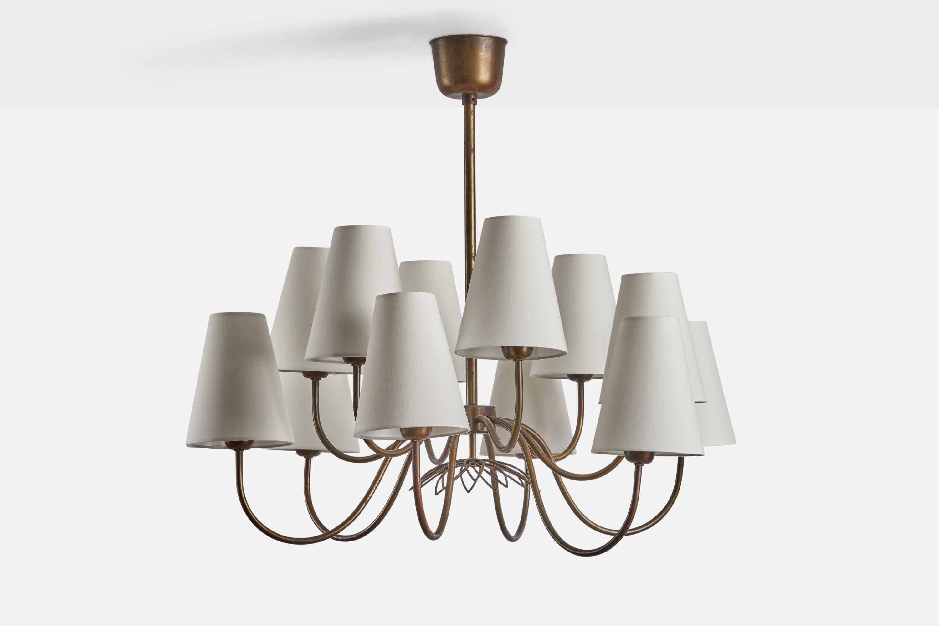 A twelve-armed brass and white fabric chandelier designed by Hans Bergström and produced by Atelje Lyktan, Åhus, Sweden, c. 1940s.

Overall Dimensions (inches): 24” H x 30” Diameter
Bulb Specifications: E-26 Bulb
Number of Sockets: 12