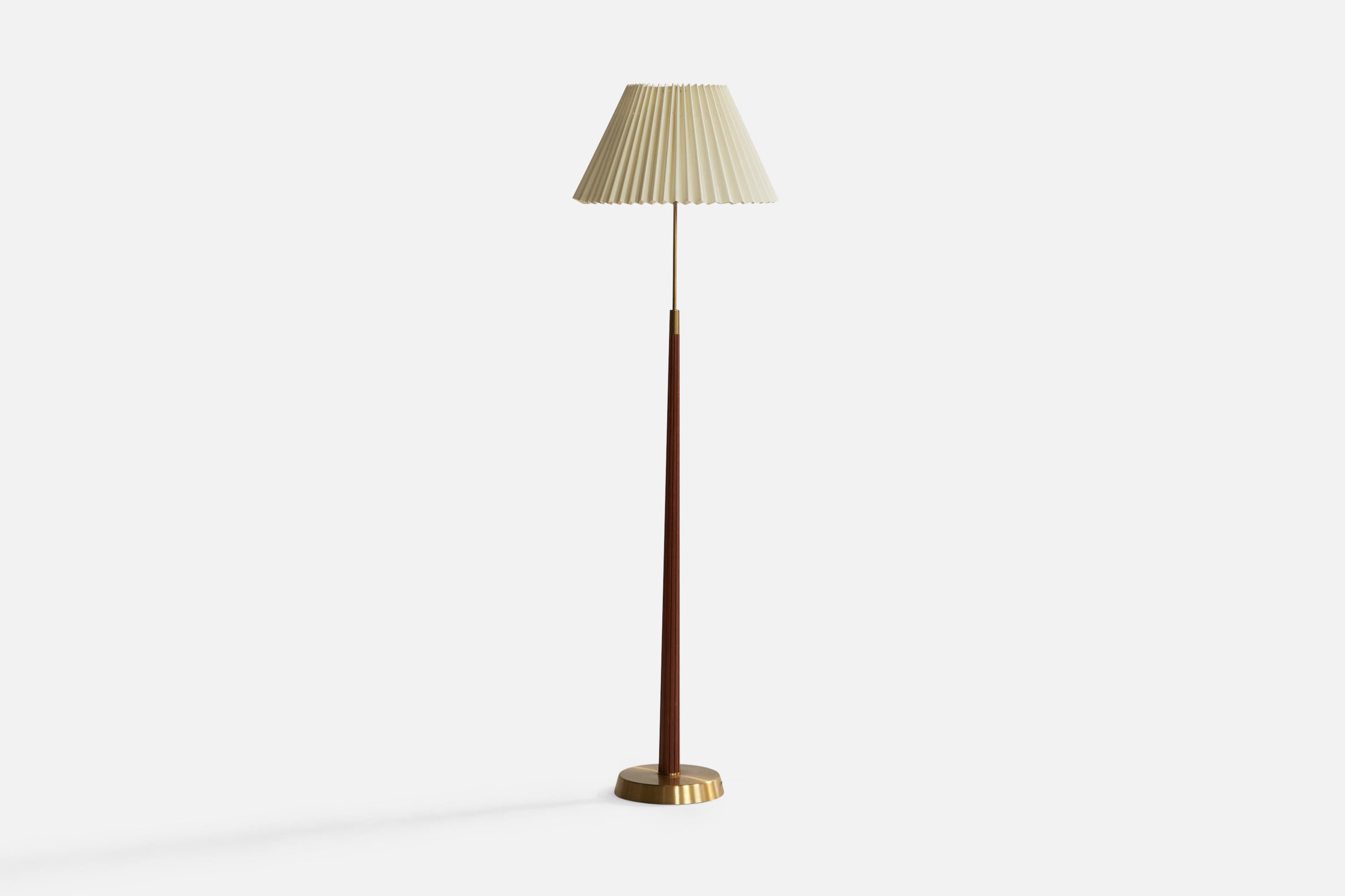 A brass, elm and off white fabric floor lamp designed by Hans Bergström and produced by ASEA, Sweden, 1940s.

Overall Dimensions (inches): 62.6” H x 17.5” Diameter. Stated dimensions include shade.
Bulb Specifications: E-26 Bulb
Number of Sockets: