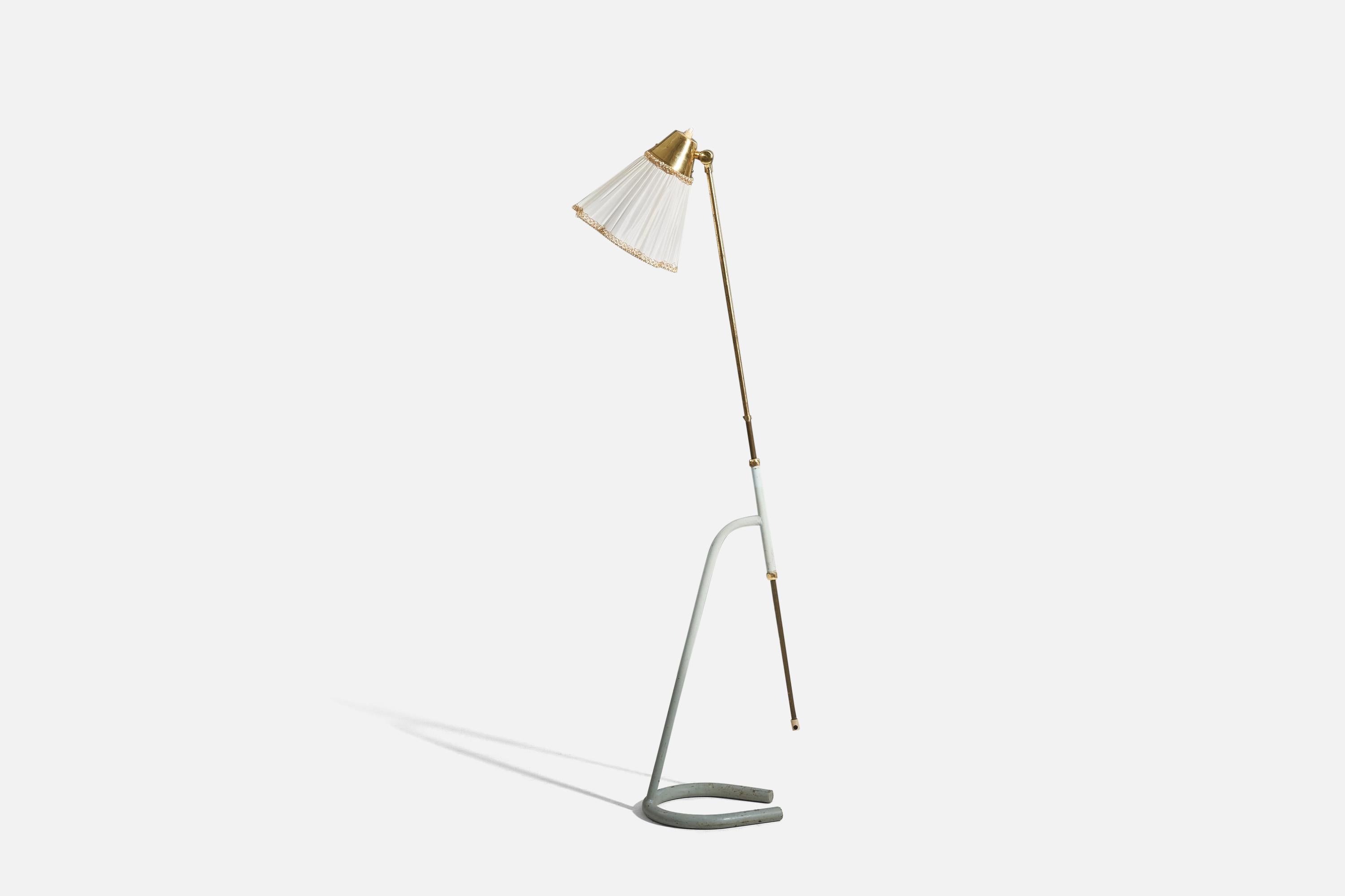 A brass, metal and fabric floor lamp designed by Hans Bergström produced by Atelje Lyktan, Sweden, 1950s.

Sold with Lampshade. 
Stated dimensions refer to the Floor Lamp with the Shade. 
Variable dimensions, measured as illustrated in the first