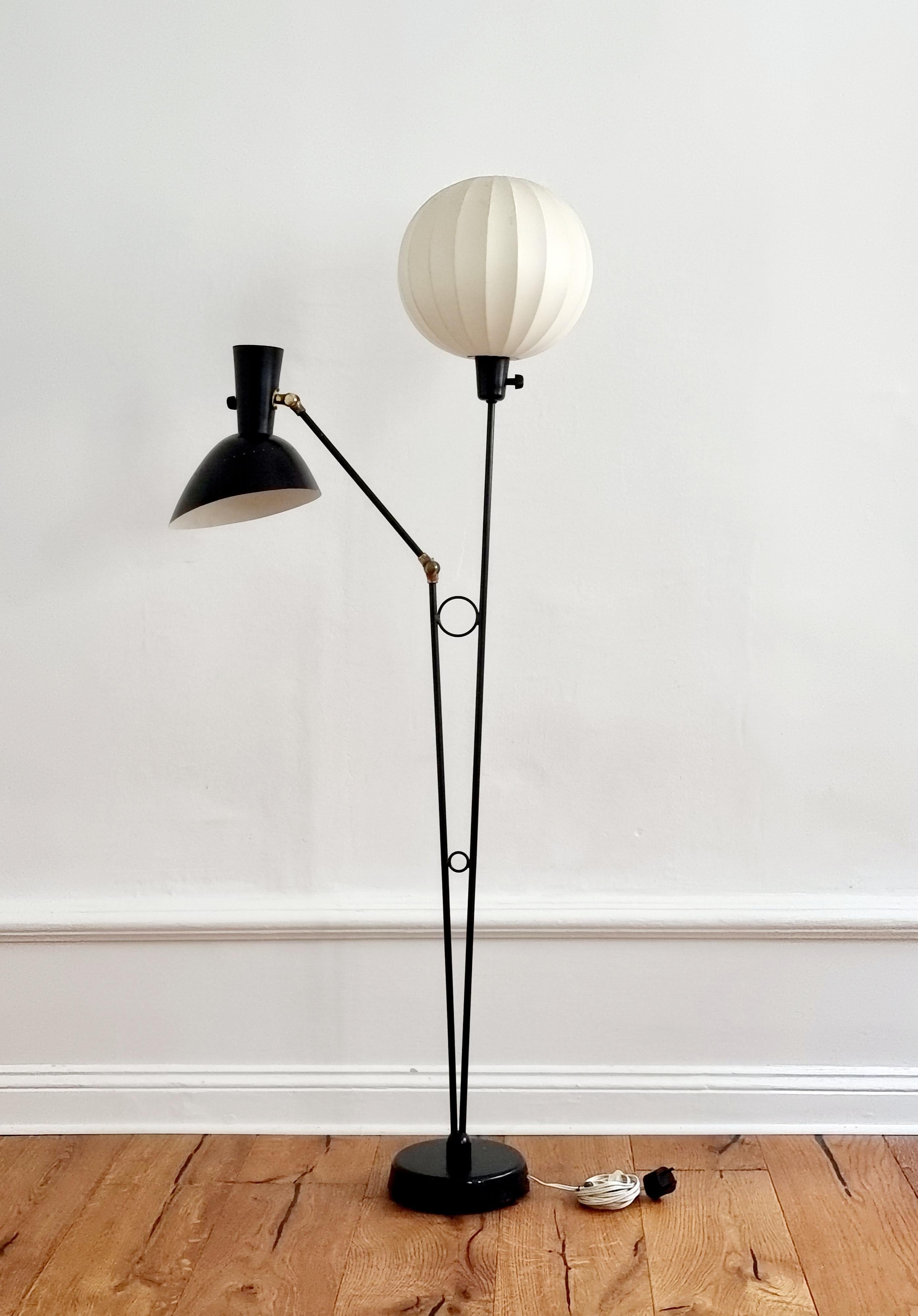 Unique floor lamp by Hans Bergström for Ateljé Lyktan. Sweden, mid-1900s. One arm is adjustable, one shade with original resin stretch.

In good condition, smaller signs of wear and color loss. Resin in good condition, no damages. The black laquer