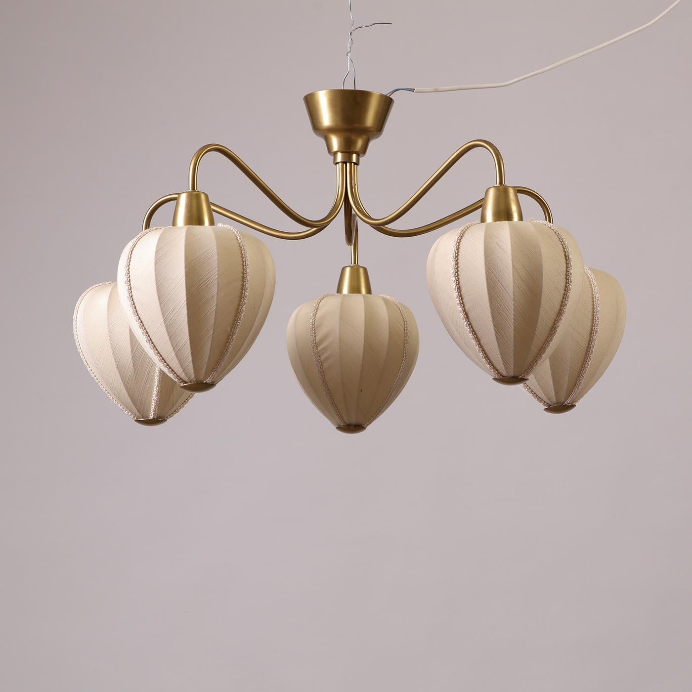 A rare 5-arm brass chandelier, model ’80’, designed by Swedish architect and lighting designer Hans Bergström (1910-1996). Manufactured by Ateljé Lyktan in the 1940s. Made of brass and features all original fabric shades. This lamp is a rare example