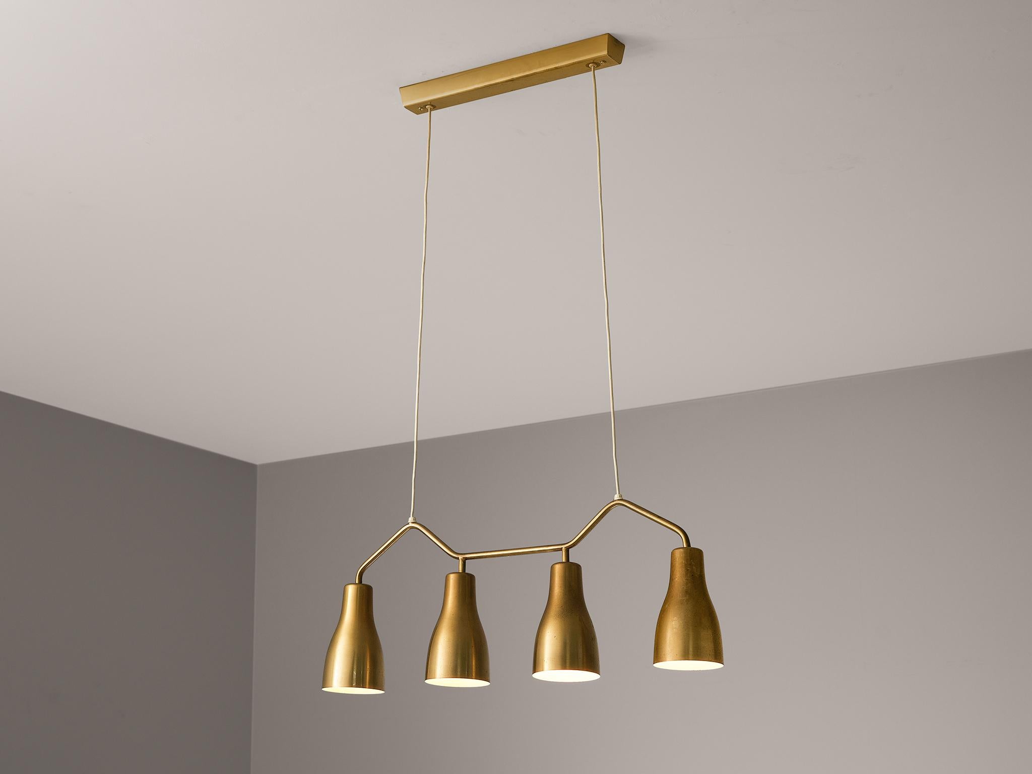 Hans Bergström for Ateljé Lyktan, chandelier, brass, Sweden, 1950s

This unique chandelier features a charming composition based on four cone-shaped shades fixated to a geometrical frame based on curved lines. The body gets beautifully suspended