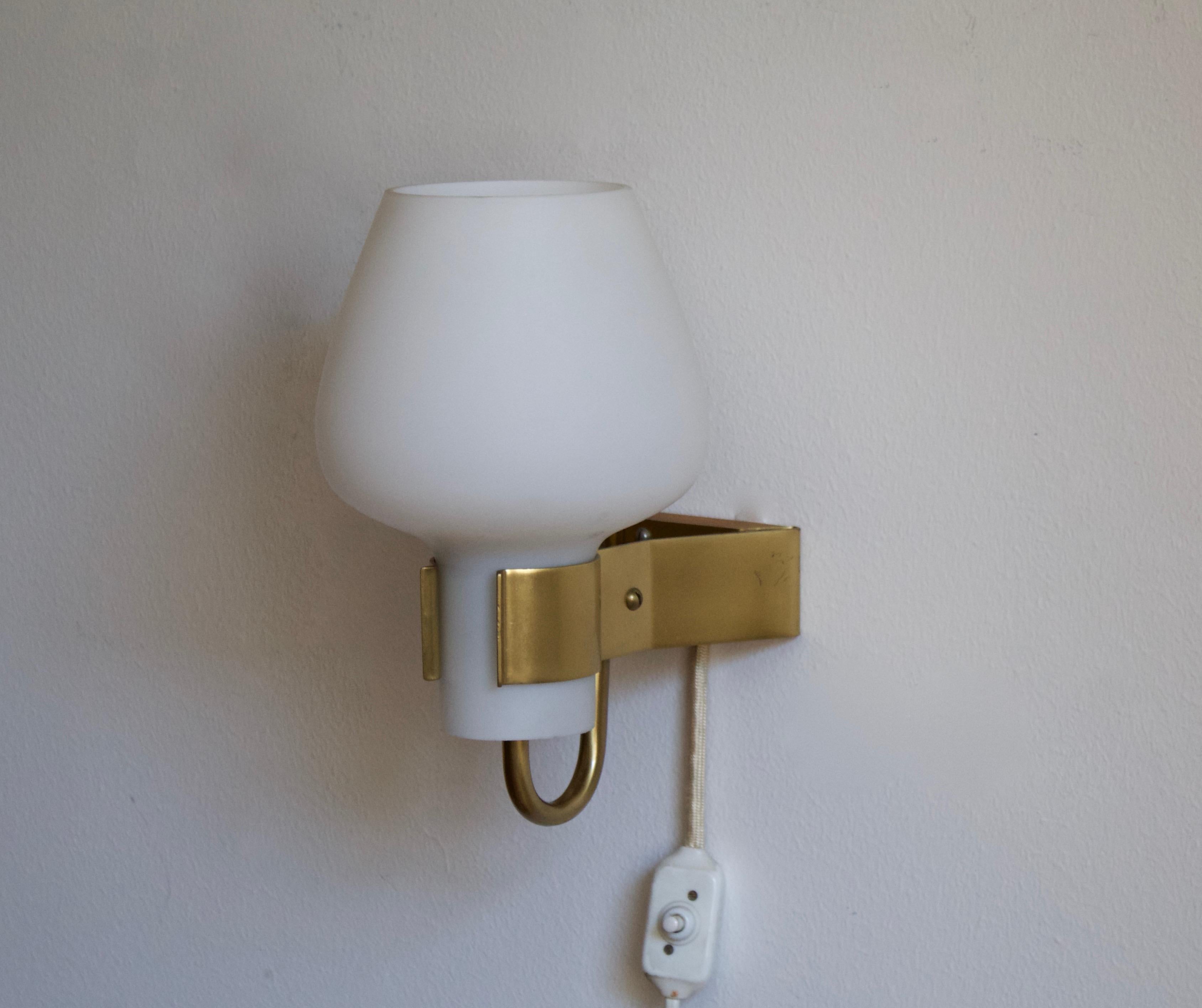 A wall light / sconce produced by Swedish Ateljé Lyktan, designed by Hans Bergström. Produced in brass, assorted vintage rattan lampshades.

Other Nordic lighting designers include Paavo Tynell, Hans-Agne Jacobson, Carl-Axel Acking, and Alvar