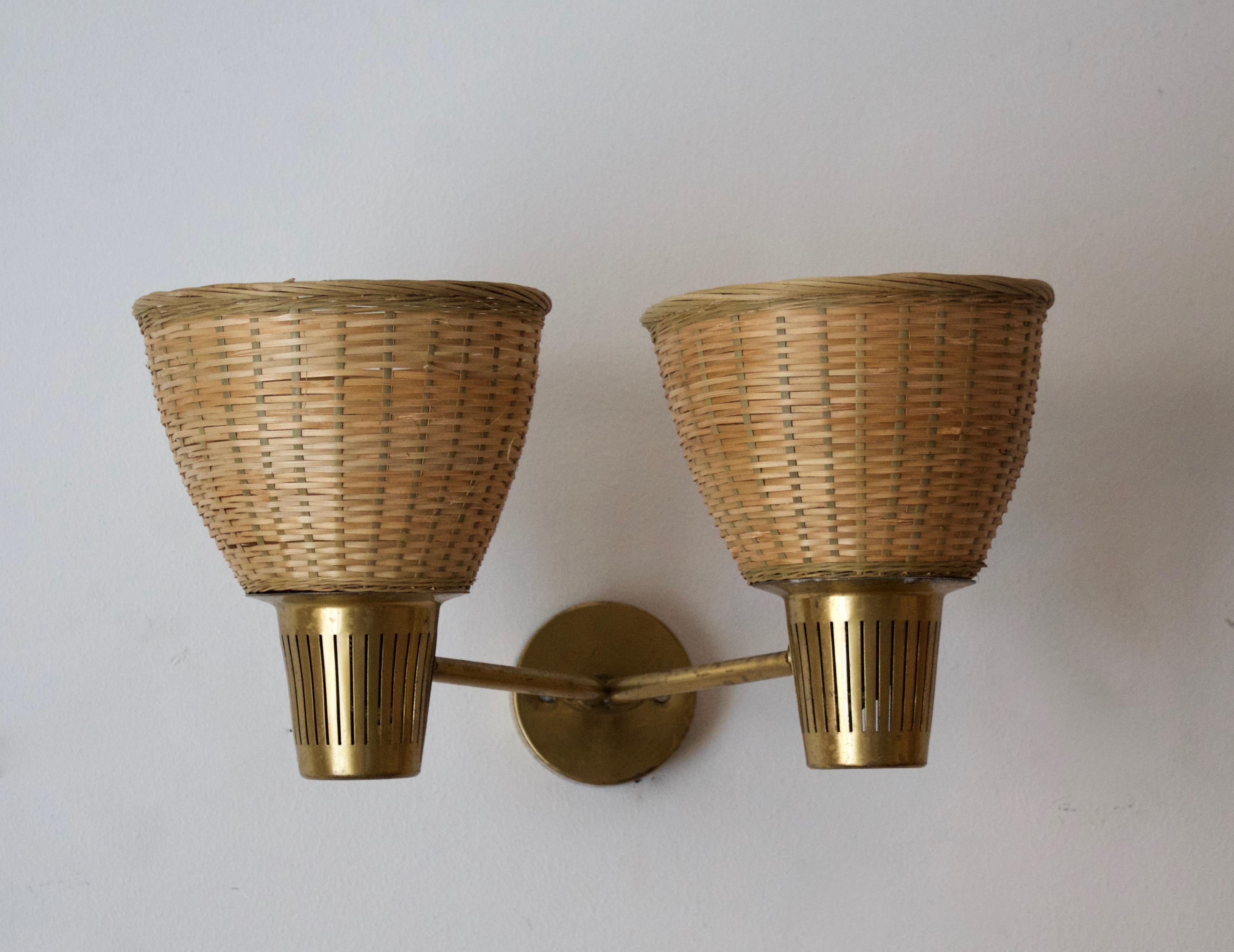 A two-armed wall light / sconce produced by Swedish Ateljé Lyktan, designed by Hans Bergström. Produced in brass, assorted vintage rattan lampshades.

Other Nordic lighting designers include Paavo Tynell, Hans-Agne Jacobson, Carl-Axel Acking, and