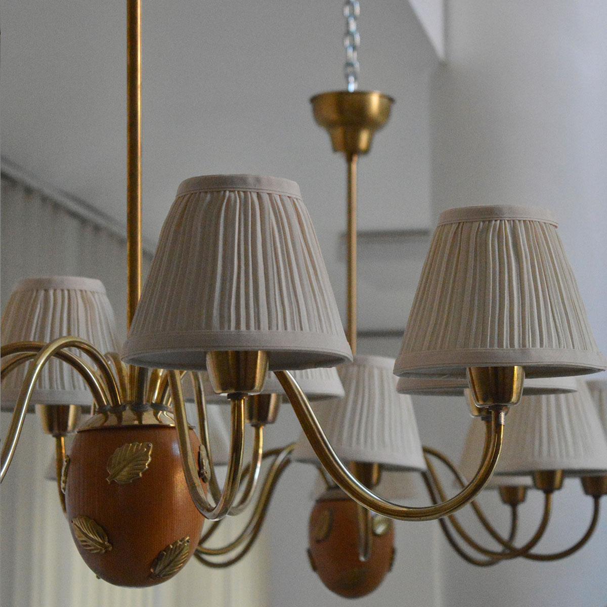 Swedish Hans Bergström Pair of Brass and Wood 8-Arm Chandeliers, 1940s For Sale