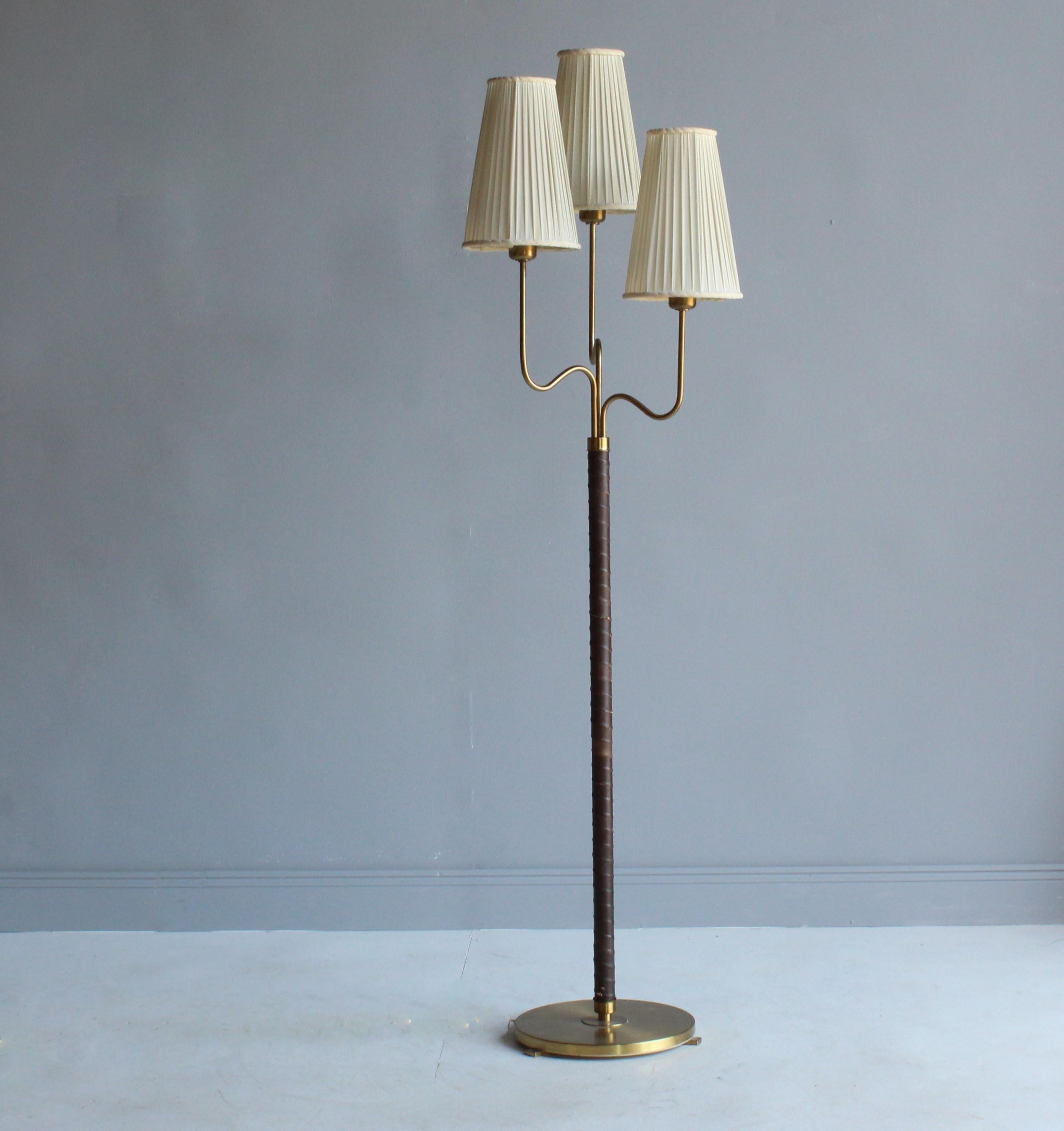 A rare floor lamp with 3 organic arms, designed by Hans Bergström in 1946. Produced by ASEA. 

Bears original screens and original dark brown leather. 

Other designers of the period include Paavo Tynell, Josef Frank, Carl-Axel Acking, Alvar