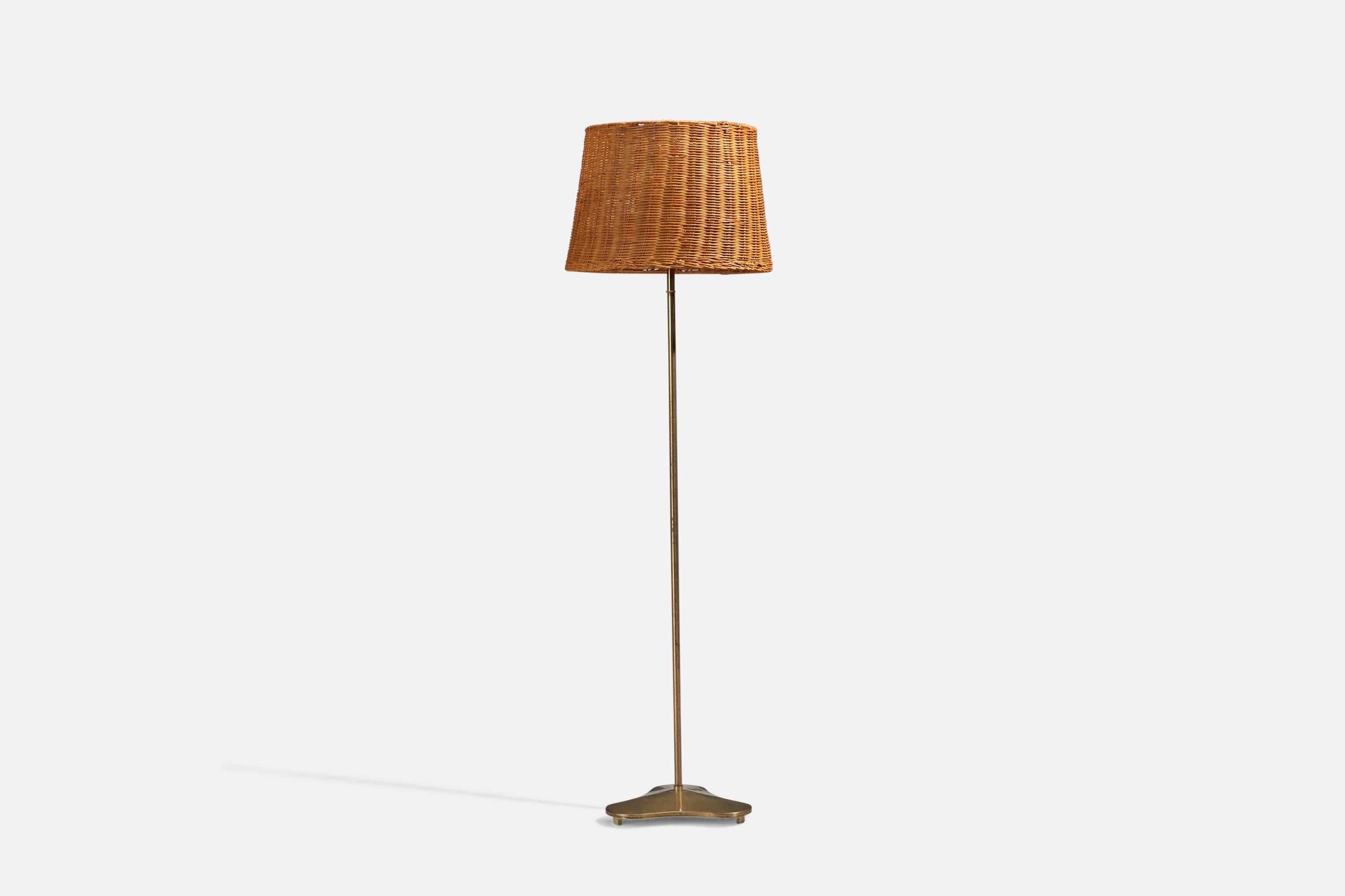 A brass and rattan floor lamp, design attributed to Hans Bergström and produced by ASEA, Sweden, 1940s.

Sold with Lampshade. Dimensions stated are of Floor Lamp with Lampshade. 

Socket takes standard E-26 medium base bulb.

There is no maximum
