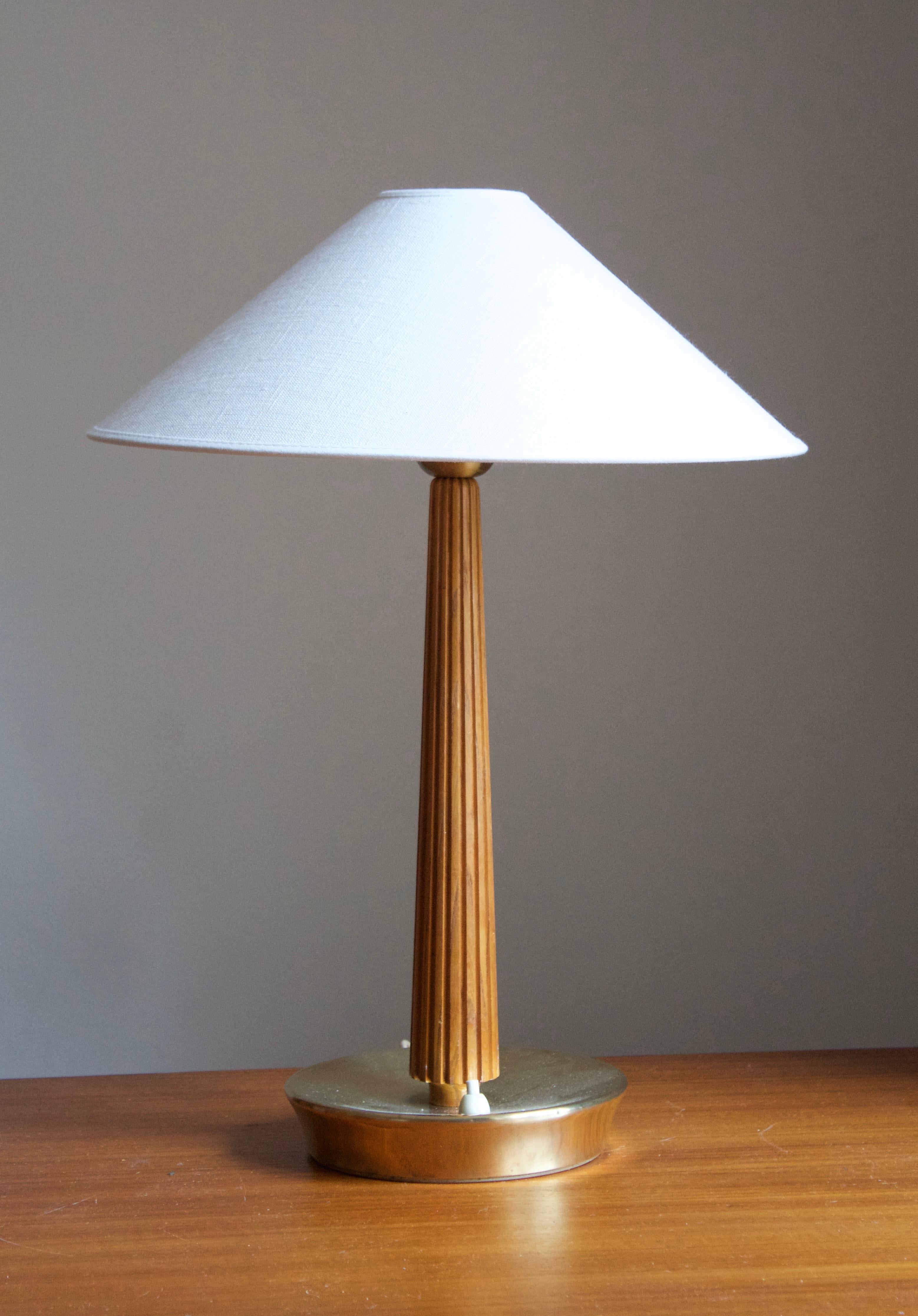 A table lamp / desk light. Designed by Swedish Hans Bergström. Produced by ASEA, Sweden, 1950s. Stamped.

Stated dimensions exclude lampshades. Height includes sockets. Sold without lampshade.