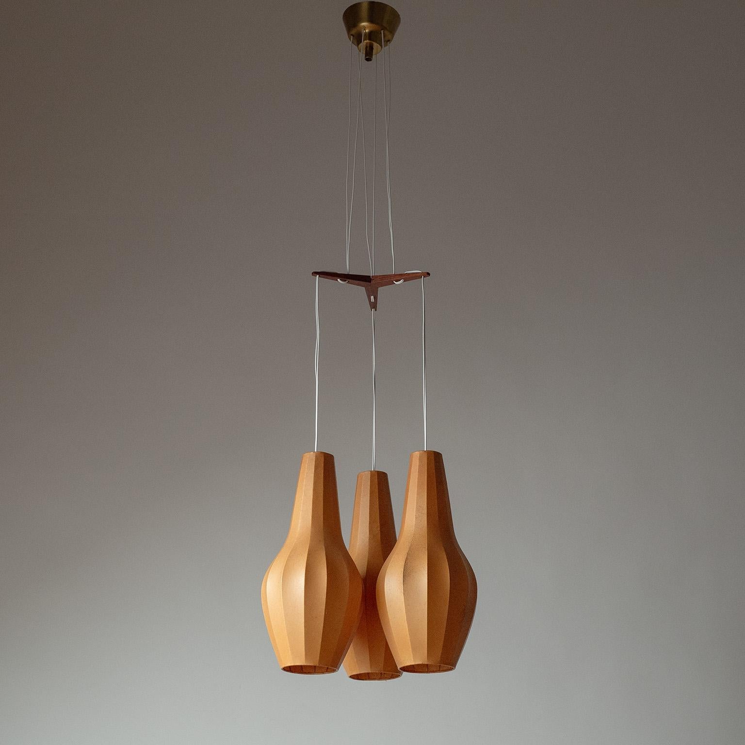 Rare tripple cocoon pendant or chandelier by Hans Bergström from the 1950s. Three vase-shaped cocoon bodies are suspended from a minimal teak element. Nice original condition with a lovely patina on the cocoons. One small tear was professionally