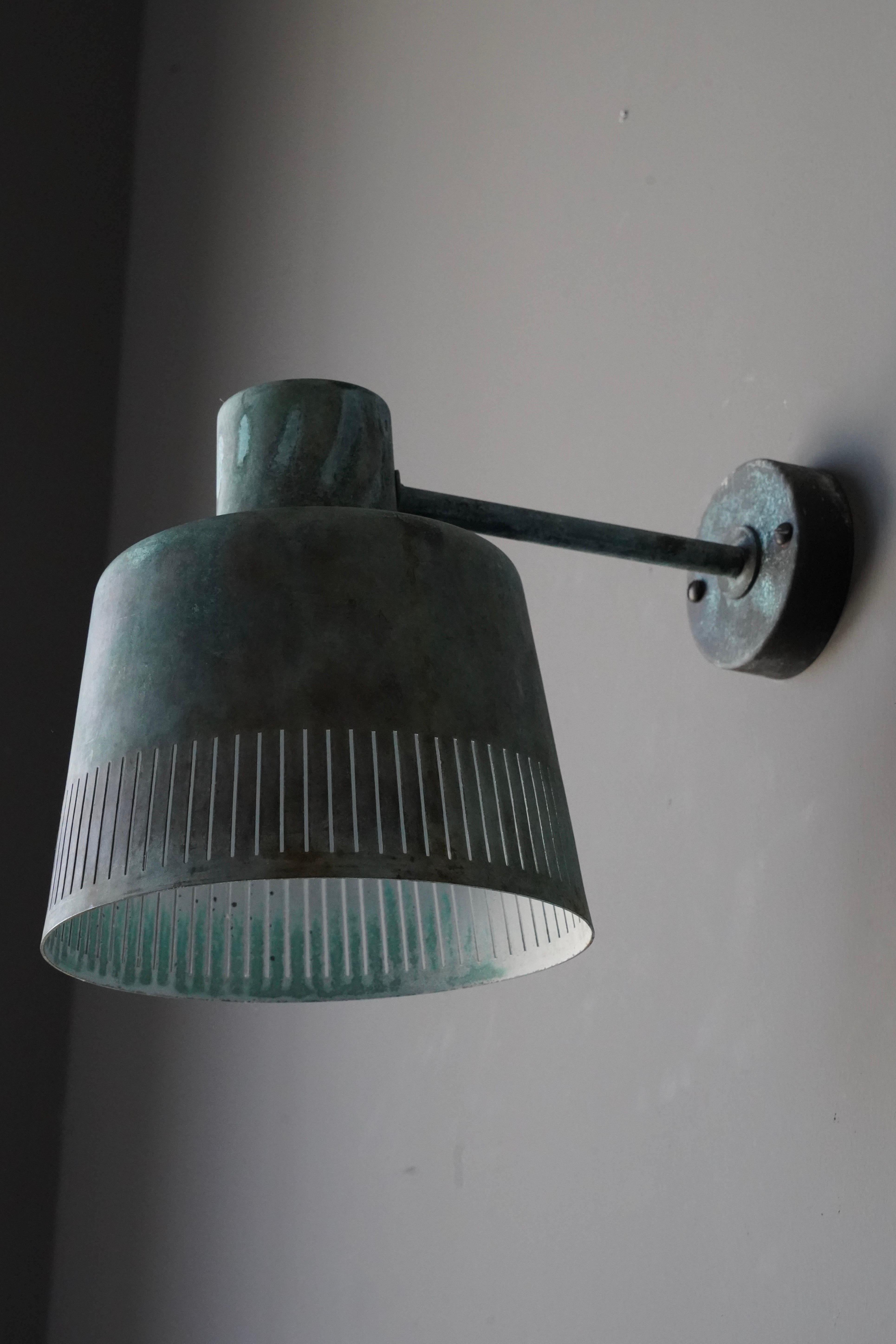A sizable wall light / sconce. Designed and produced by Hans Bergström, for his own firm, Atelje Lyktan Sweden, circa 1949.

Verdigris Copper has retained very dramatic and appealing patina over time.

Other designers of the period include Paavo