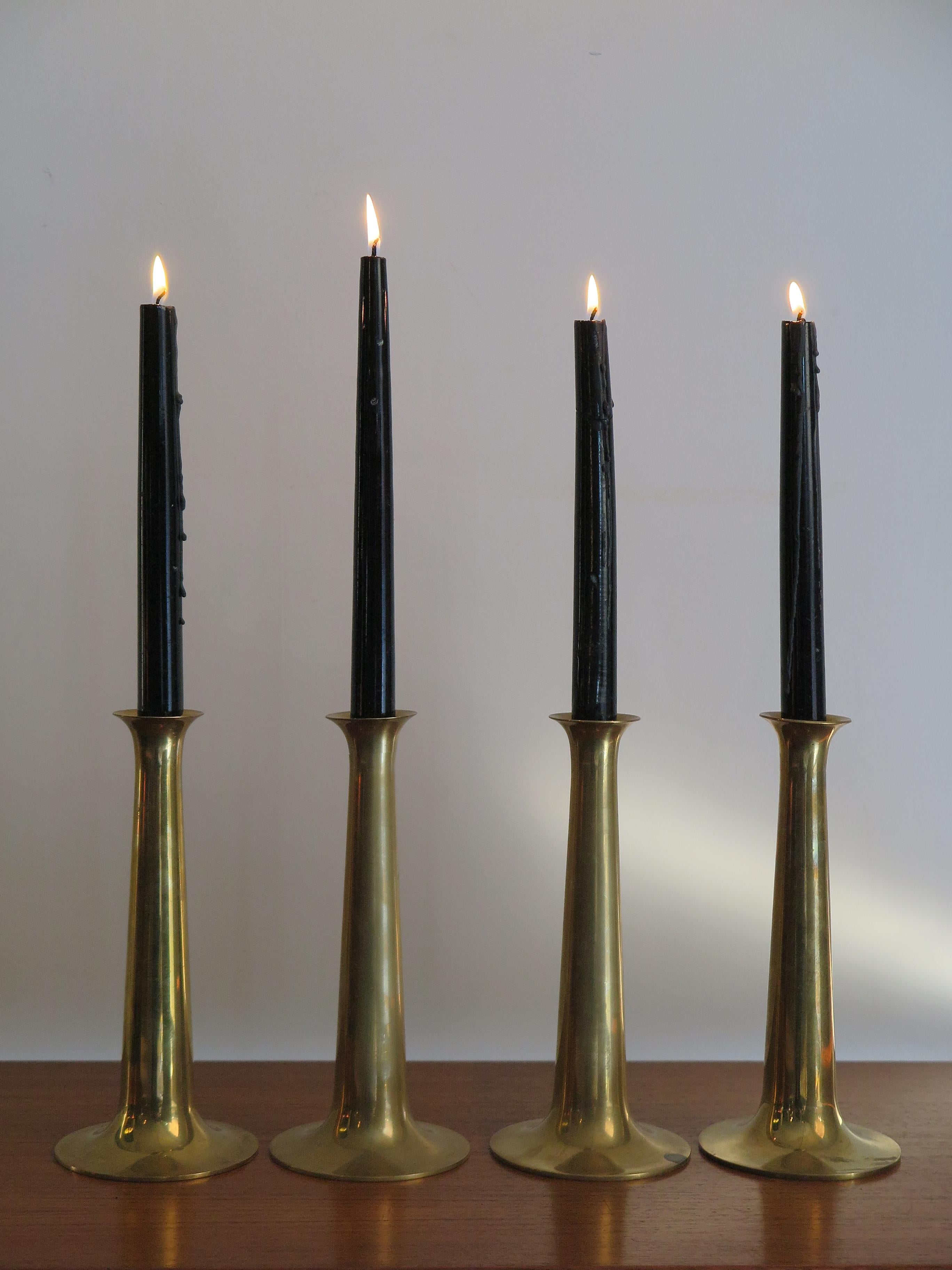 Set of Scandinavian midcentury modern candlesticks designed by Hans Bolling and manufactured by Torben Orskov in Denmark, they are made from solid brass and feature the manufacturer's mark to each base, 1950s.

Please note that the items are