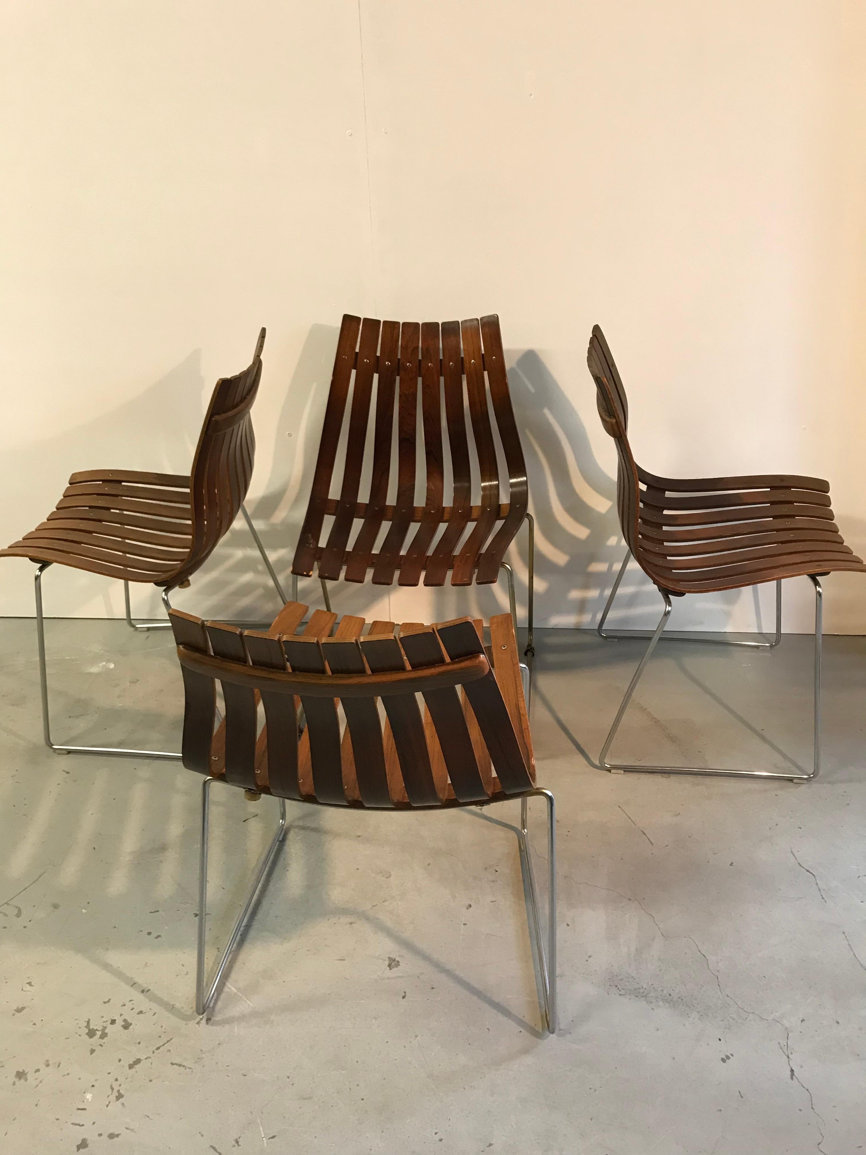 Set of 4 dining chairs designed for Hove Mobler, Norway called Scandia.
They are constructed from rosewood bentwood slats resting on a steel base. They sit wonderfully well and are in good condition.
