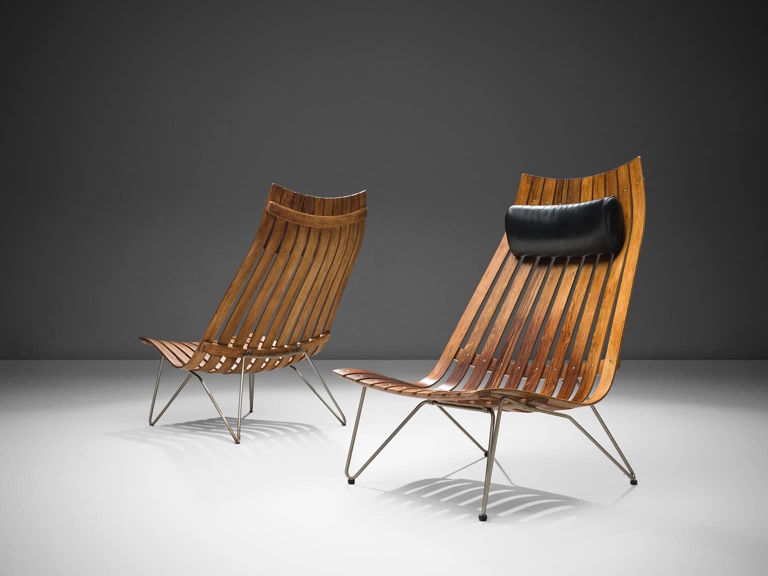 Hans Brattrud for Hove Mobler, lounge chairs model 'Scandia' in rosewood and metal, Norway, circa 1957. 

This set of chairs was part of the Scandia series, designed by Norwegian designer Hans Brattrud and produced by Hove Mobler. The chairs are