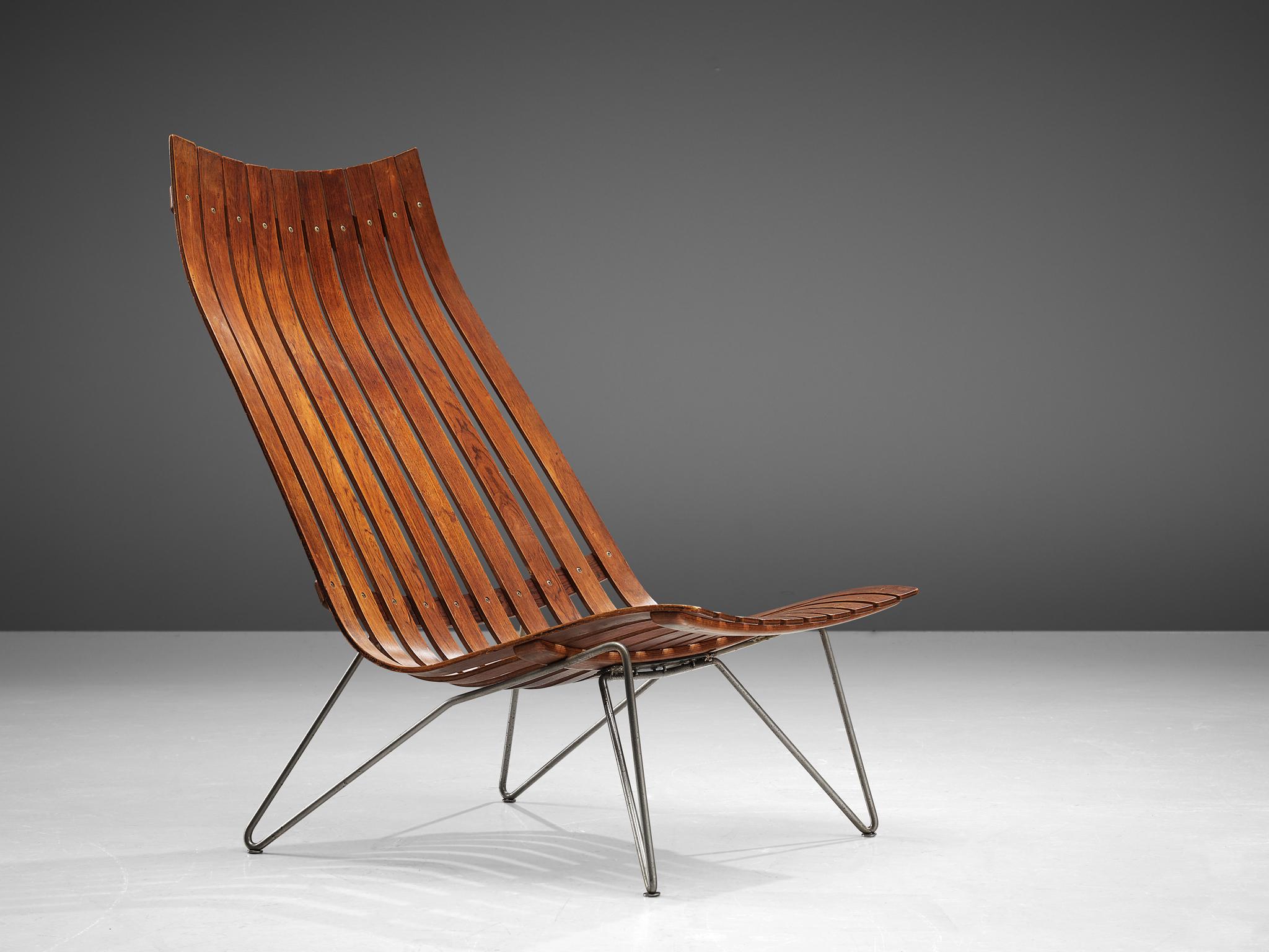 Hans Brattrud for Hove Mobler, lounge chair model 'Scandia' in rosewood and metal, Norway, circa 1957. 

This chair was part of the Scandia series, designed by Norwegian designer Hans Brattrud and produced by Hove Mobler. The chair is executed in