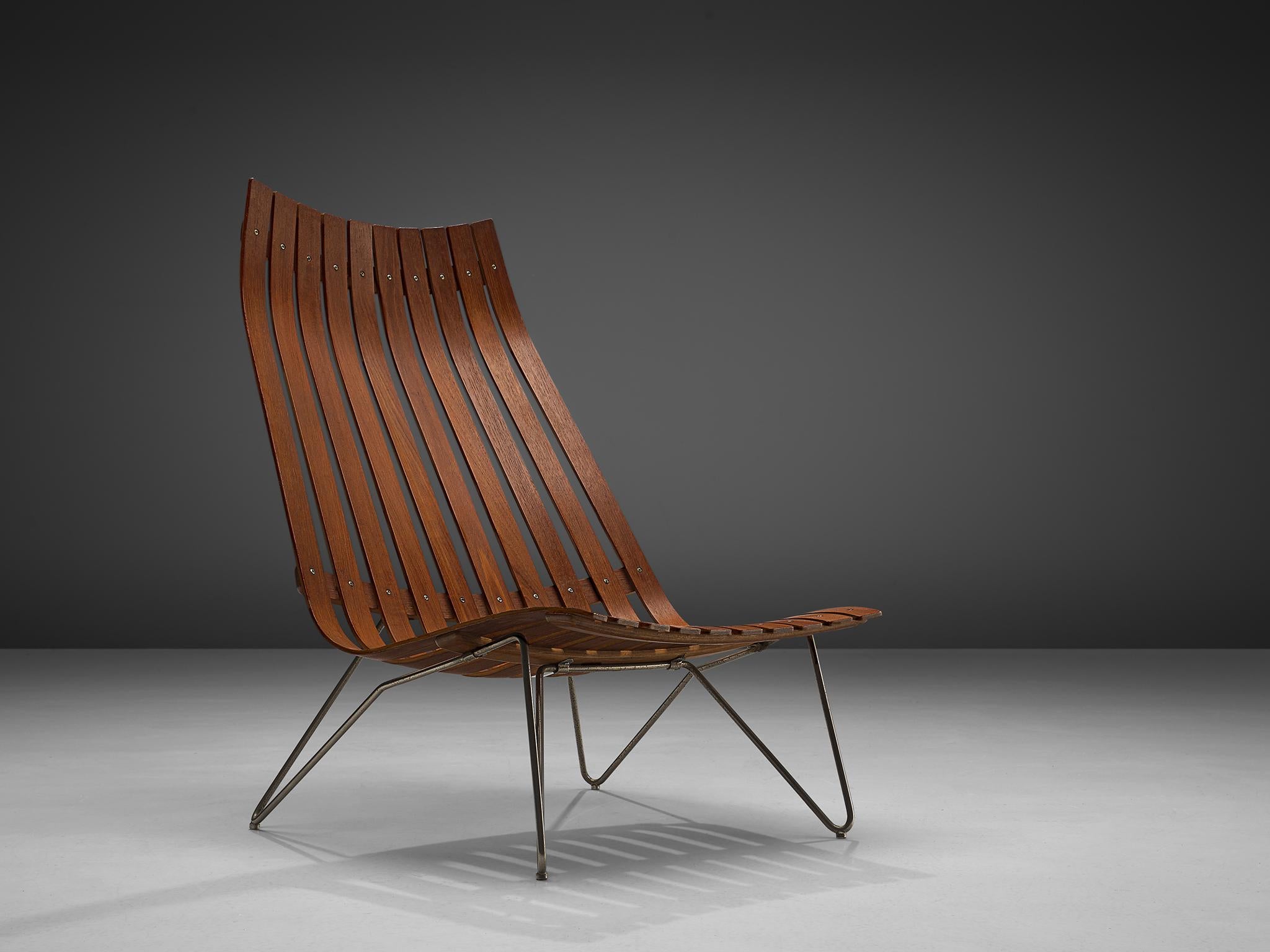 Hans Brattrud for Hove Mobler, lounge chair model 'Scandia' in teak and metal, Norway, circa 1957. 

This chair was part of the Scandia series, designed by Norwegian designer Hans Brattrud and produced by Hove Mobler. The chair is executed in bent