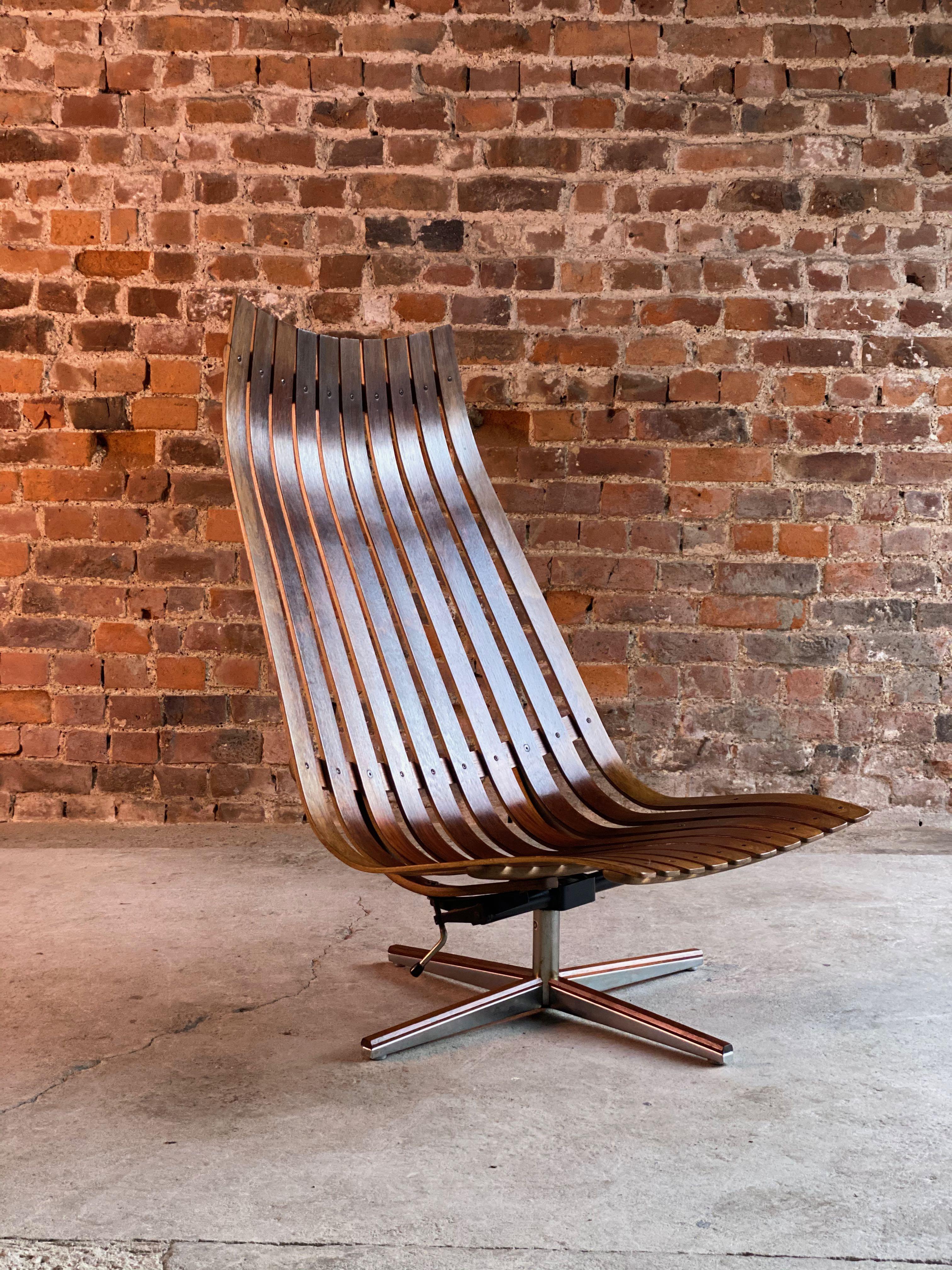 Hans Brattrud Scandia rosewood lounge chair by Georg Eknes, Norway, circa 1970

We are delighted to offer a Scandia Rio rosewood slatted lounge chair Norway circa 1970, designed by Hans Brattrud for Georg Eknes, on a revolving stand, labelled