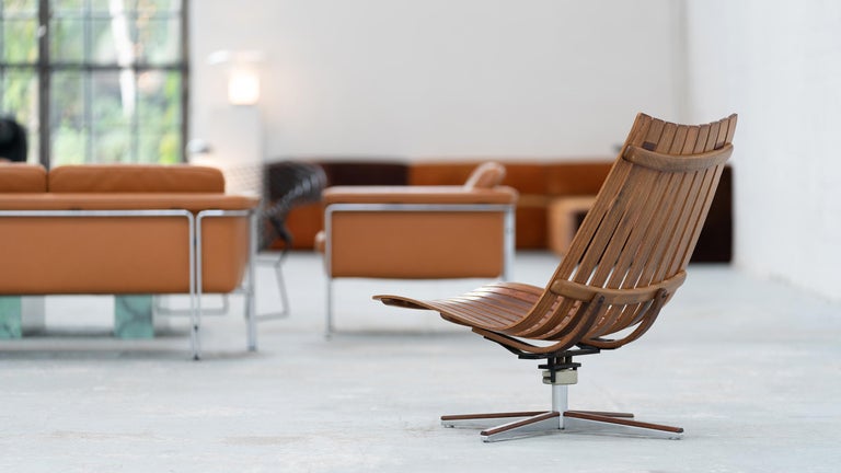 Hans Brattrud for Hove Møbler, Norway, 1957

Scandia swivel lounge chair with removable leather cushions. 
Captains return mechanism. 
Amazing condition. 

An extremely shapely lounge chair of Scandinavian modernity, due to its curved slatted