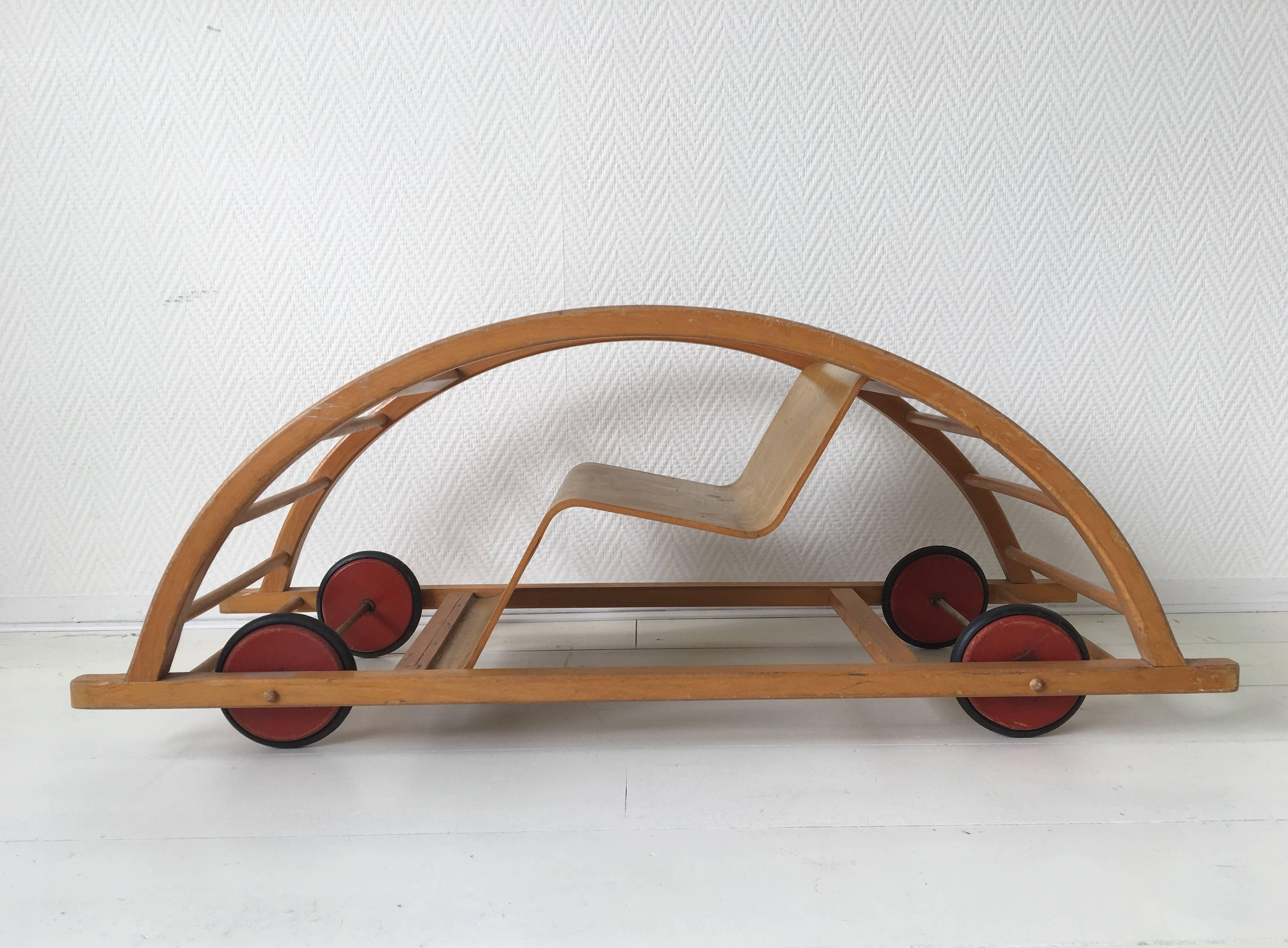 It's a kind of magic, you would think when you see this child's car turn into a rocking chair, well no but a very well designed piece of child's furniture it sure is!

This piece was designed by Hans Brockhage and produced by Siegried Lenz in the