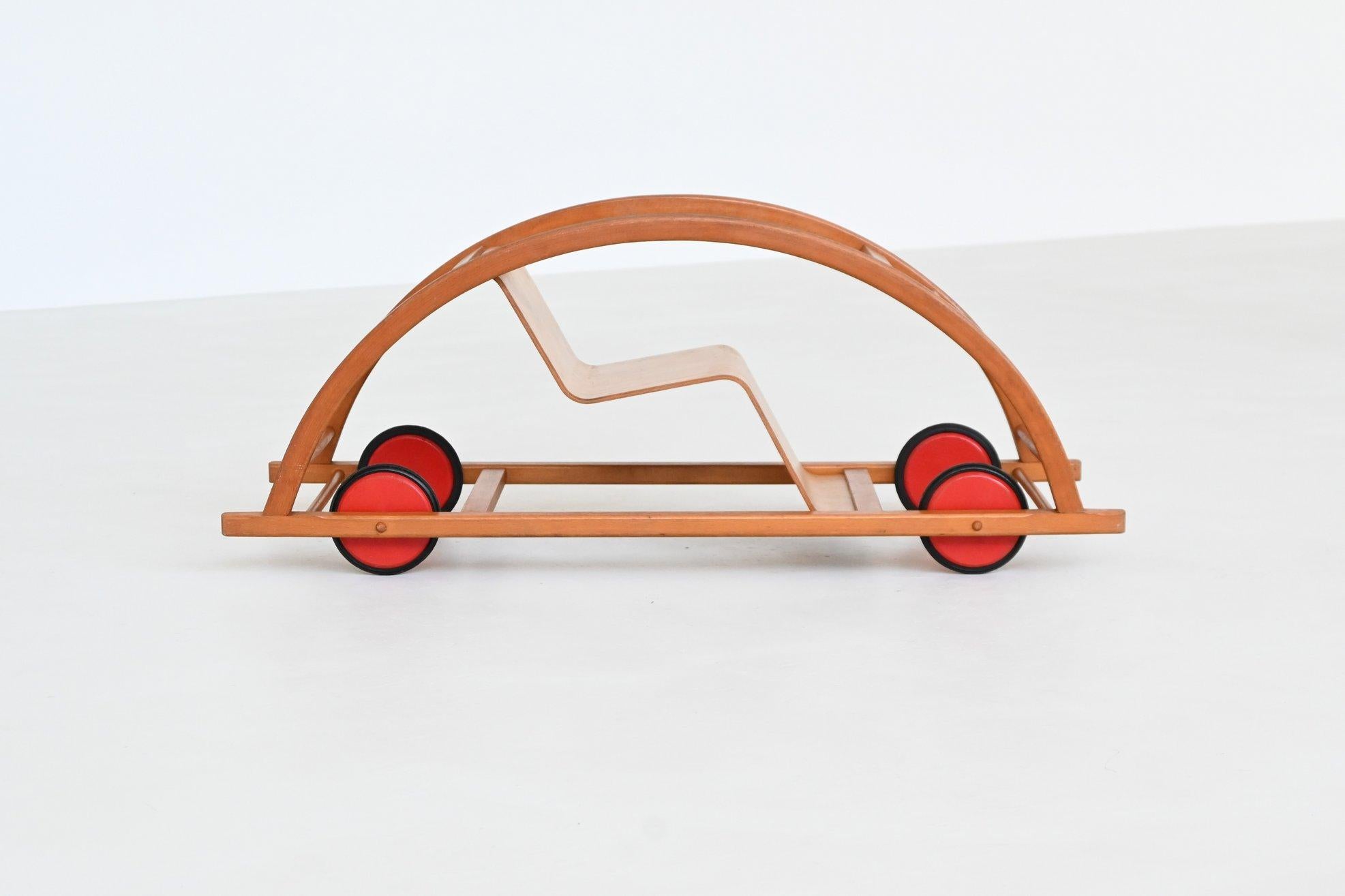 Convertible Schaukelwagen designed by Hans Brockhage and Erwin Andrä, manufactured by Siegfried Lenz, Germany 1957. This iconic piece of mid-century design is both a rocking chair and a ride-on toy, ingeniously constructed to flip from one function