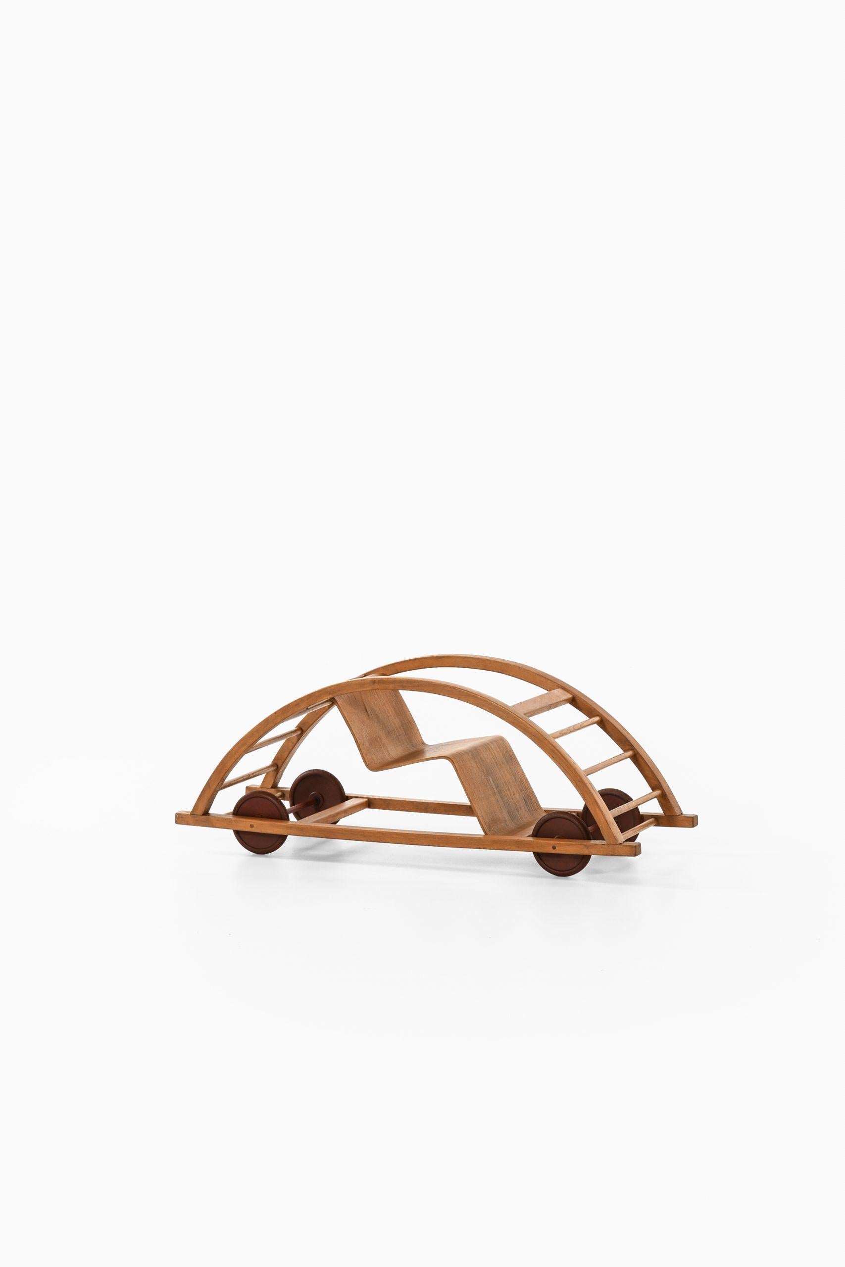 Rare swing cart designed by Hans Brockhage & Erwin Andrea. Produced by Gottfried Lenz in Germany. The swing cart can be used as a toy vehicle or as a rocking chair.