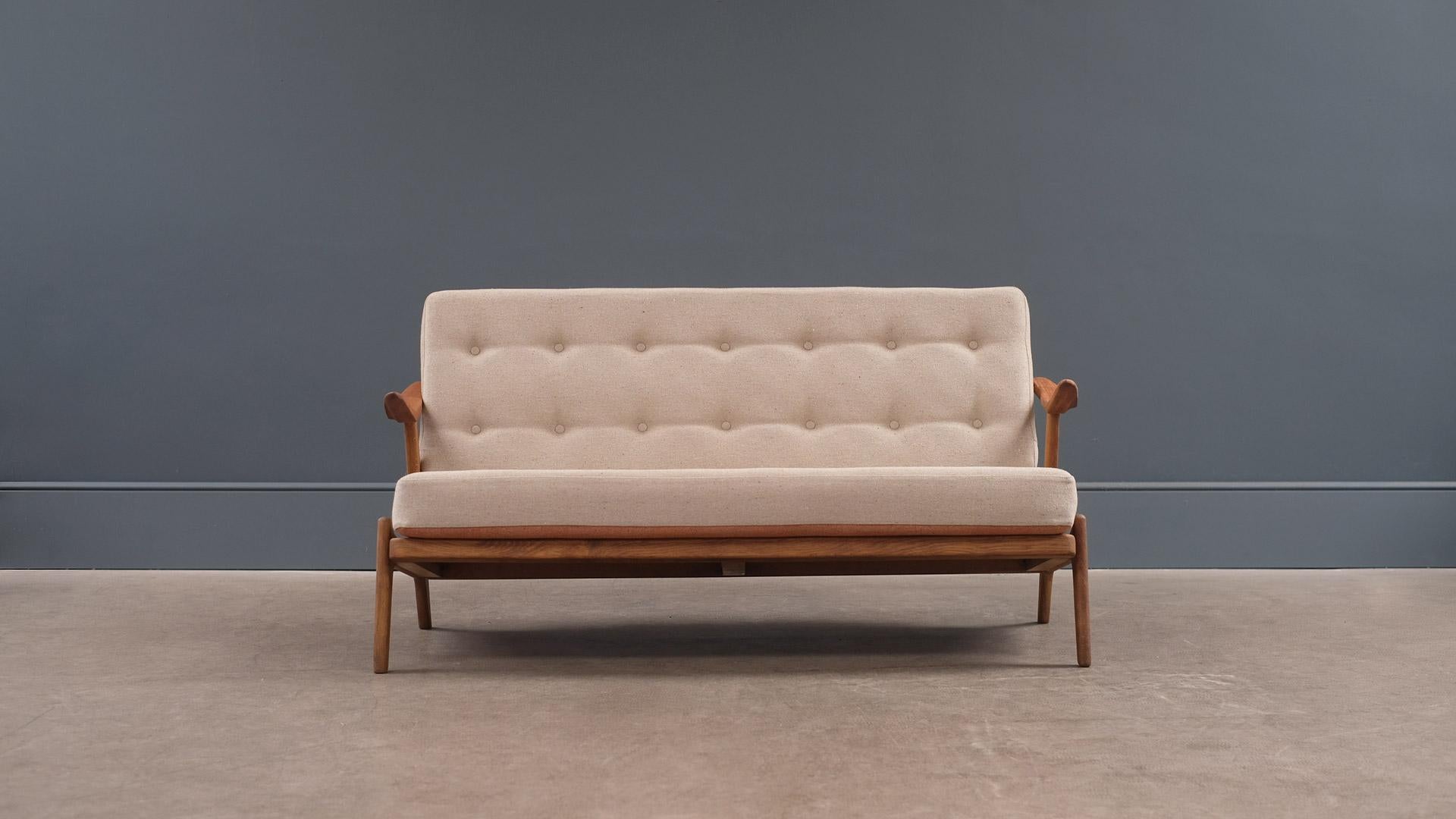 Very nice sofa in solid oak with teak arms designed by Hans Brockmann-Petersen for Randers, 1955, Denmark. Original sprung cushions full refurbished and reupholstered in reversible Fleck fabric.