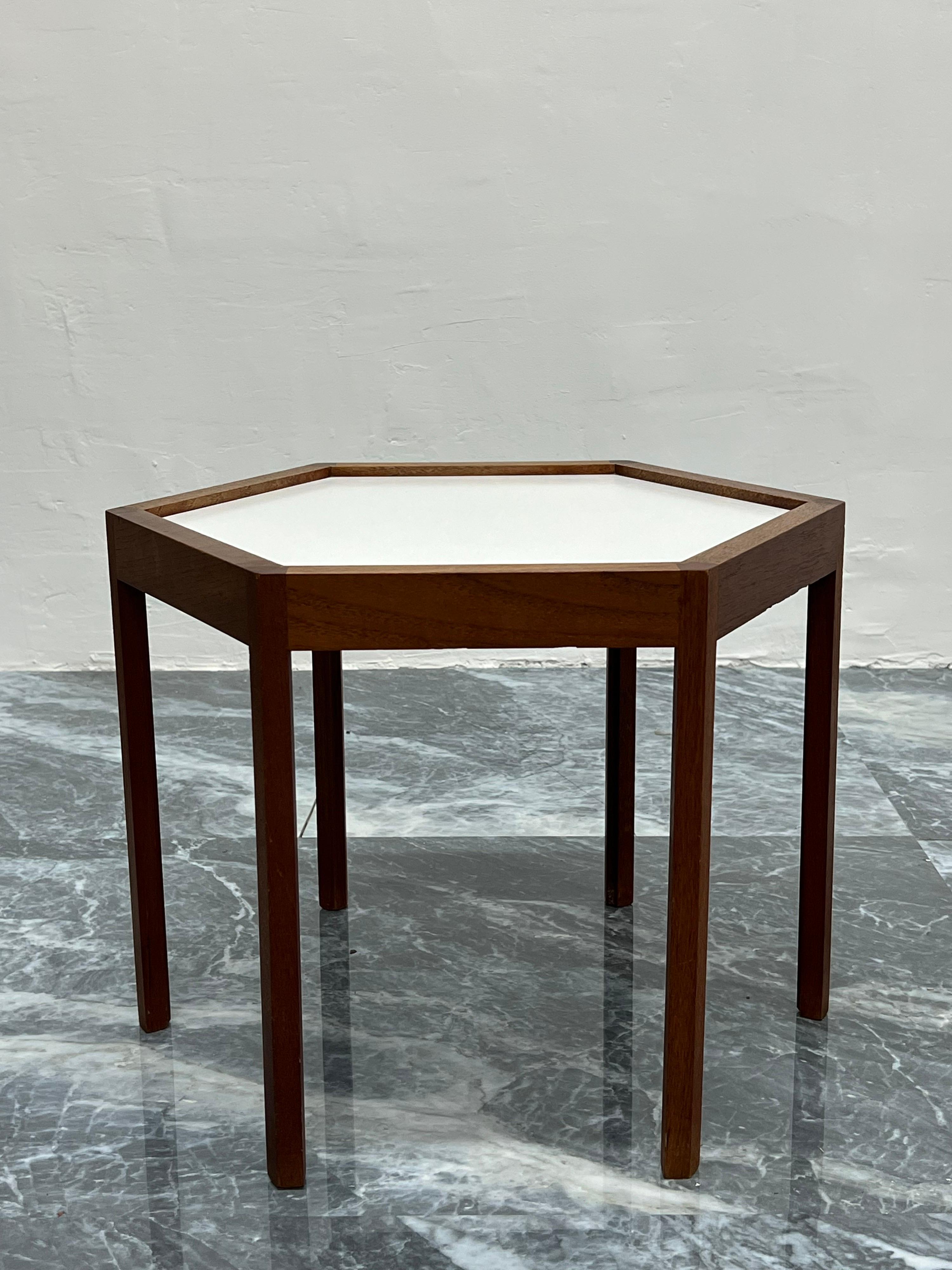 Danish modern side table with white laminate top and rosewood hexagonal frame by Hans C Andersen circa 1960s.