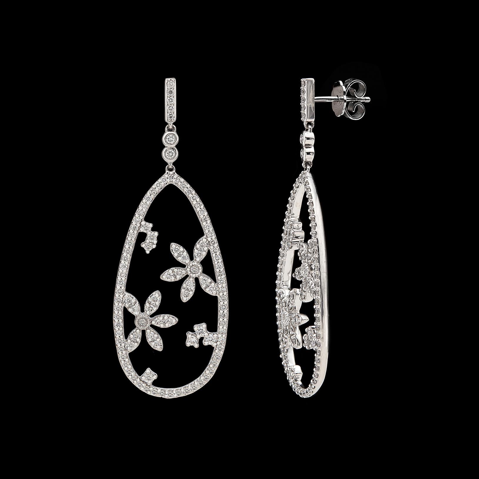 Romantic and fun, these diamond and 18k white gold drop earrings by Hans Kreiger are the perfect gift! The teardrop-shaped pendant earrings with floral accents are pave-set with 198 round brilliant-cut diamonds totaling 1.52 carats, G/VS quality.