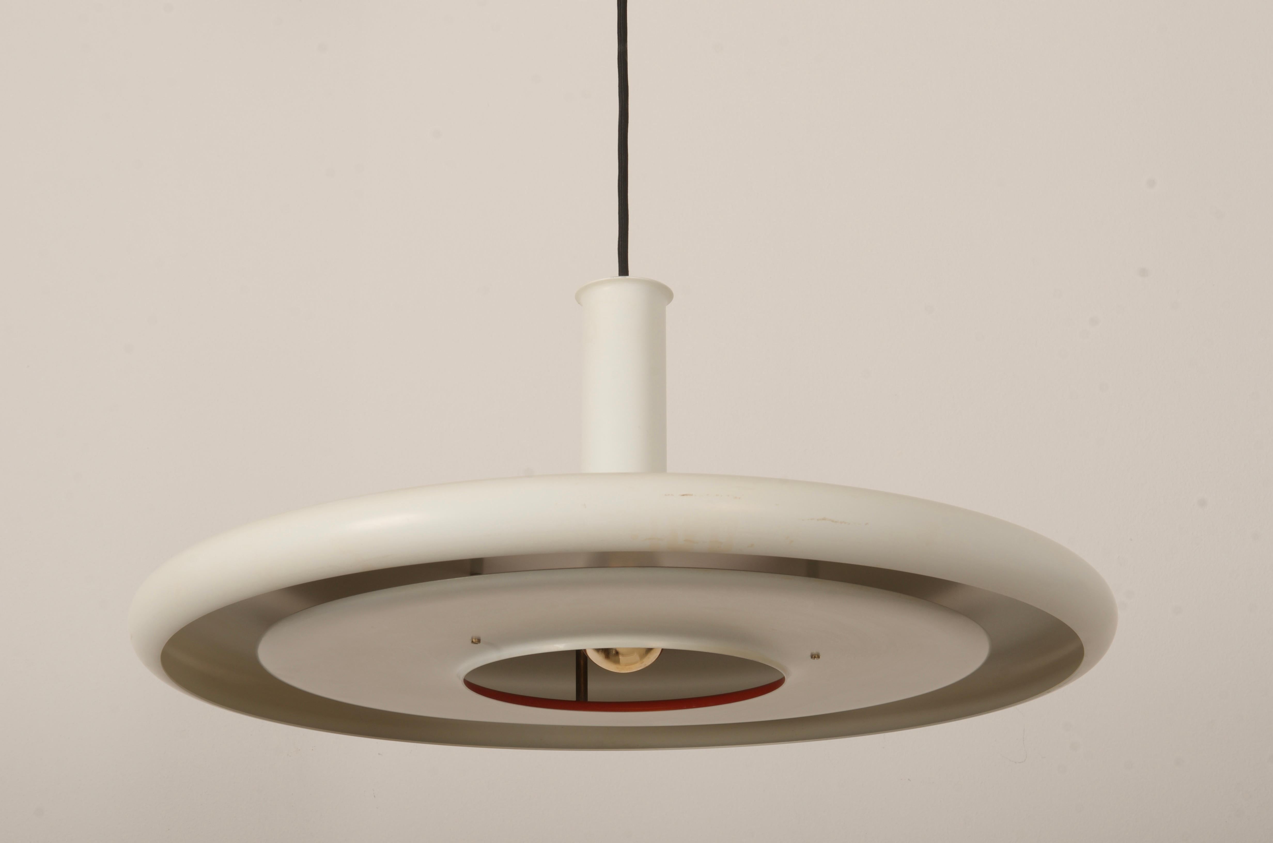 Danish UFO style pendant ceiling light ’Optima’ designed by Hans Due for Fog & Morup. Launched in 1972 the ‘Optima’ series has a definite ‘Space Age’ feel with its sleek futuristic design, looking almost impossibly thin from a side profile. It is in