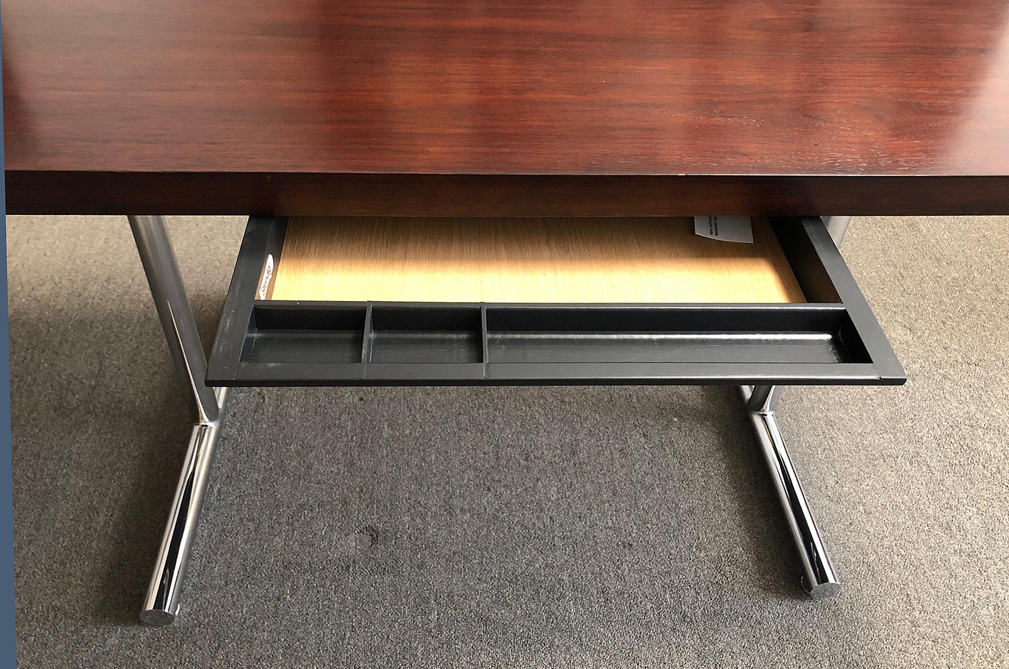 Mahogany and steel single drawer table desk. Designed by Hans Eichenberg, made by Haussman and Hausmann fo Stendig. Top quality craftsmanship and materials.