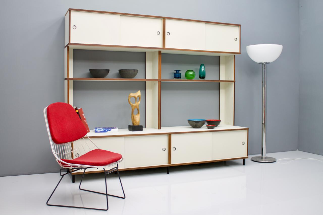 Rare shelf with sideboards and shelves from the furniture system M125 by Hans Gugelot for Bofinger, Germany, 1956.
The cabinets have sliding doors.
The system can be easily mounted and extended with additional parts as desired.

Good to very