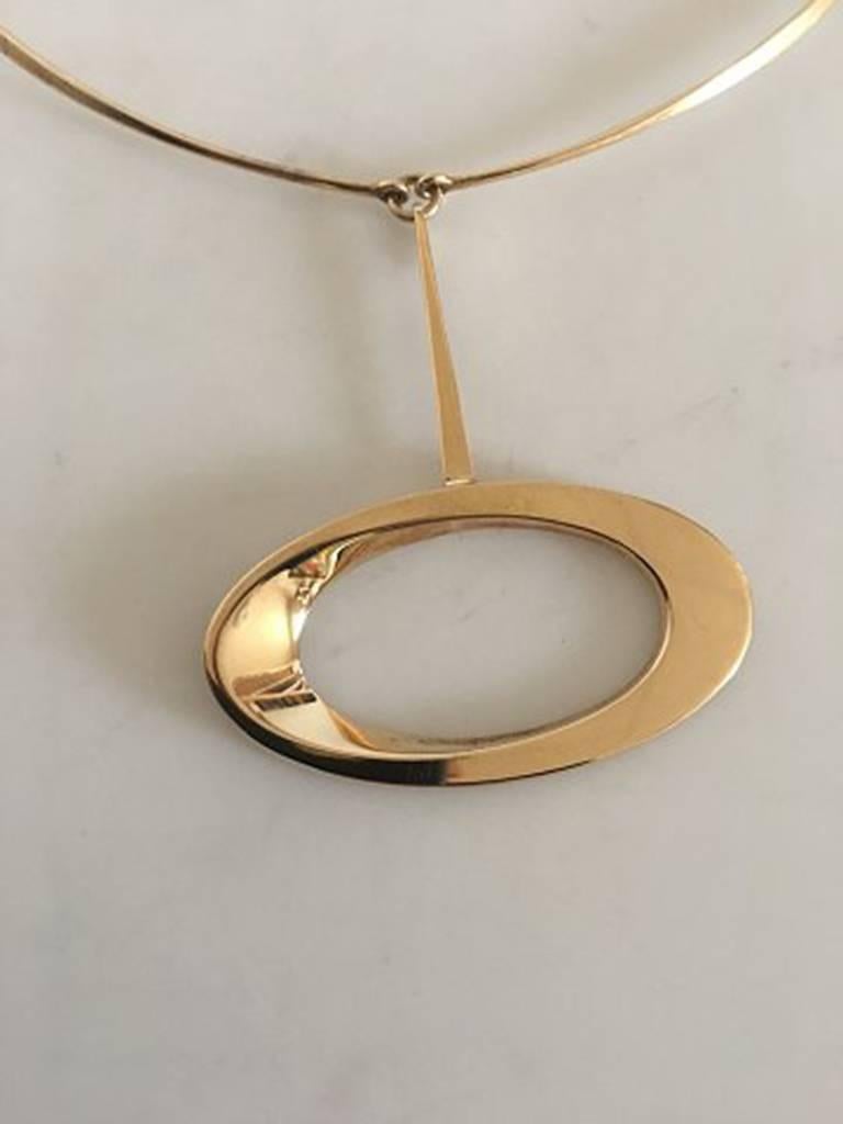 Hans Hansen 14K Gold Pendant No 103 in 14K Gold Chain (Not by Hans Hansen). Diameter of the neck ring measures 12 cm / 4 23/32 in. Oval diameter of the pendant measures 5.5 cm / 2 11/64 in. Weighs 25 / 0.90 oz.

