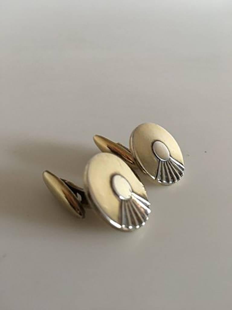 Hans Hansen Cufflinks in Gilded Silver. Measures 1.5 cm in diameter / 0 19/32 in. Combined weight of 15 g / 0.55 oz.