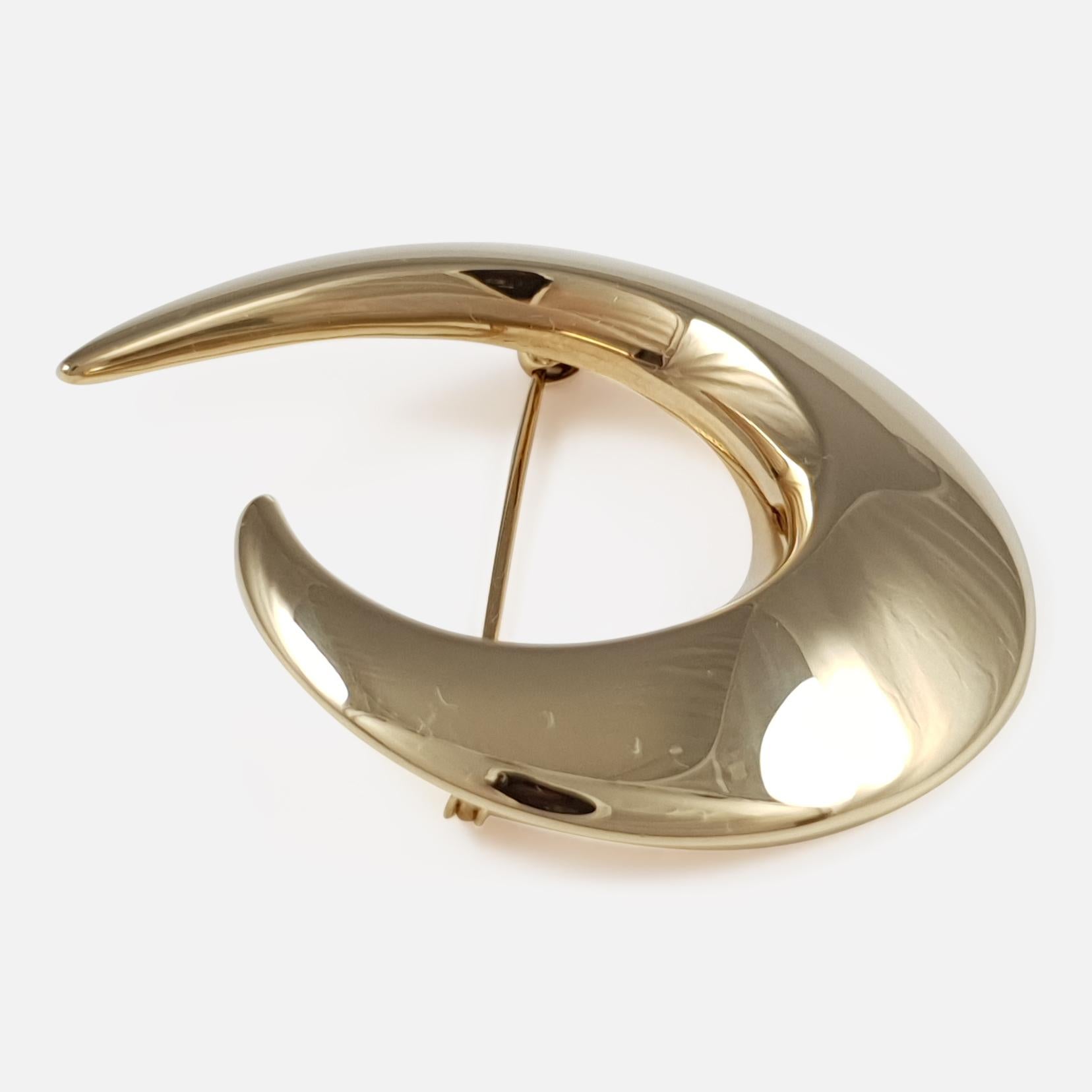 A Danish 14 karat yellow gold crescent brooch, by Hans Hansen. The brooch is stamped with the facsimile signature of 'Hans Hansen', '585', & 'Denmark'. The brooch is UK hallmarked, stamped '585' to denote 14 karat (carat) gold.

The brooch measures