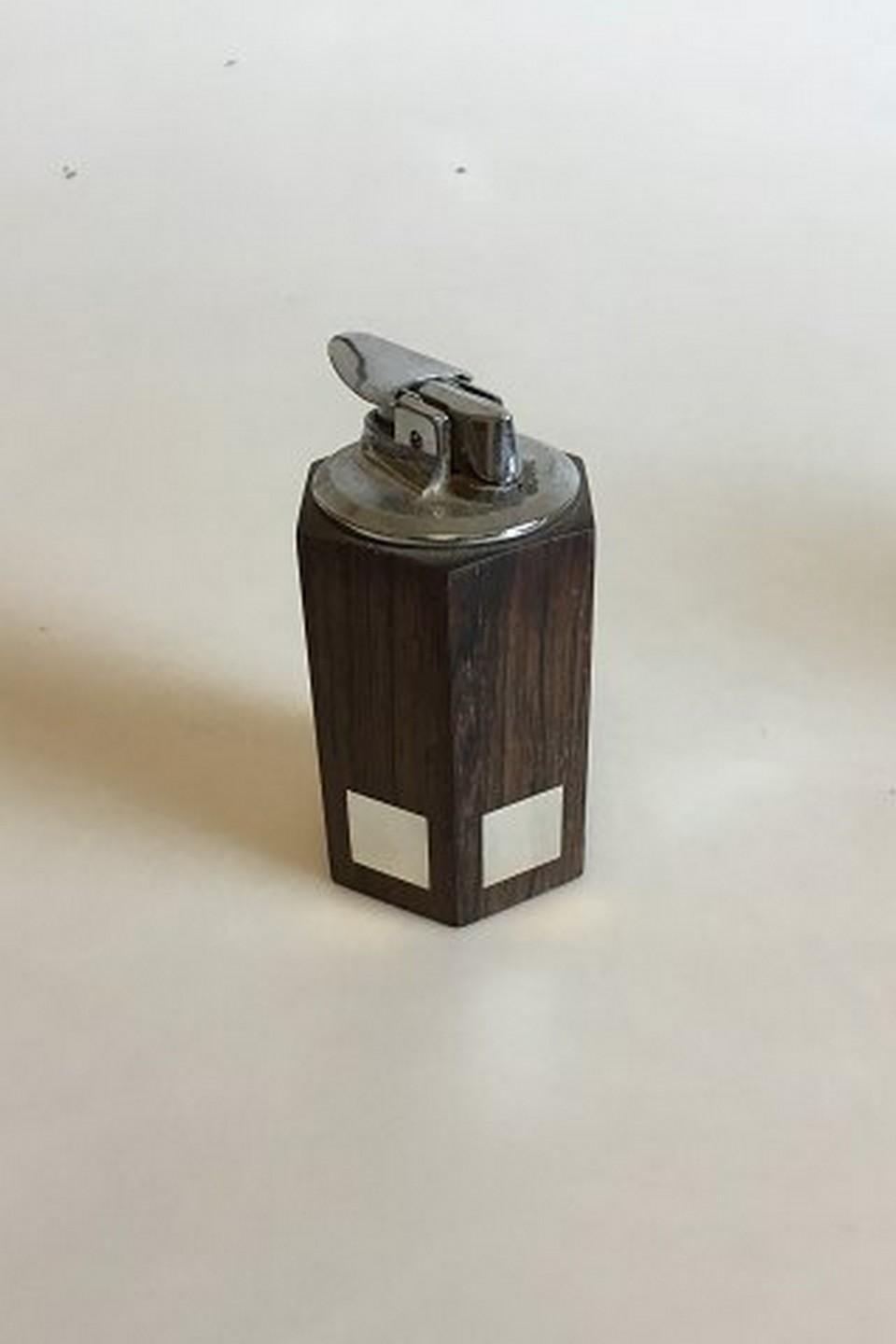 Hans Hansen rosewood and sterling silver hexagonal lighter. Measures: 10 cm / 3 15/16 in.
Item no.: 360869.