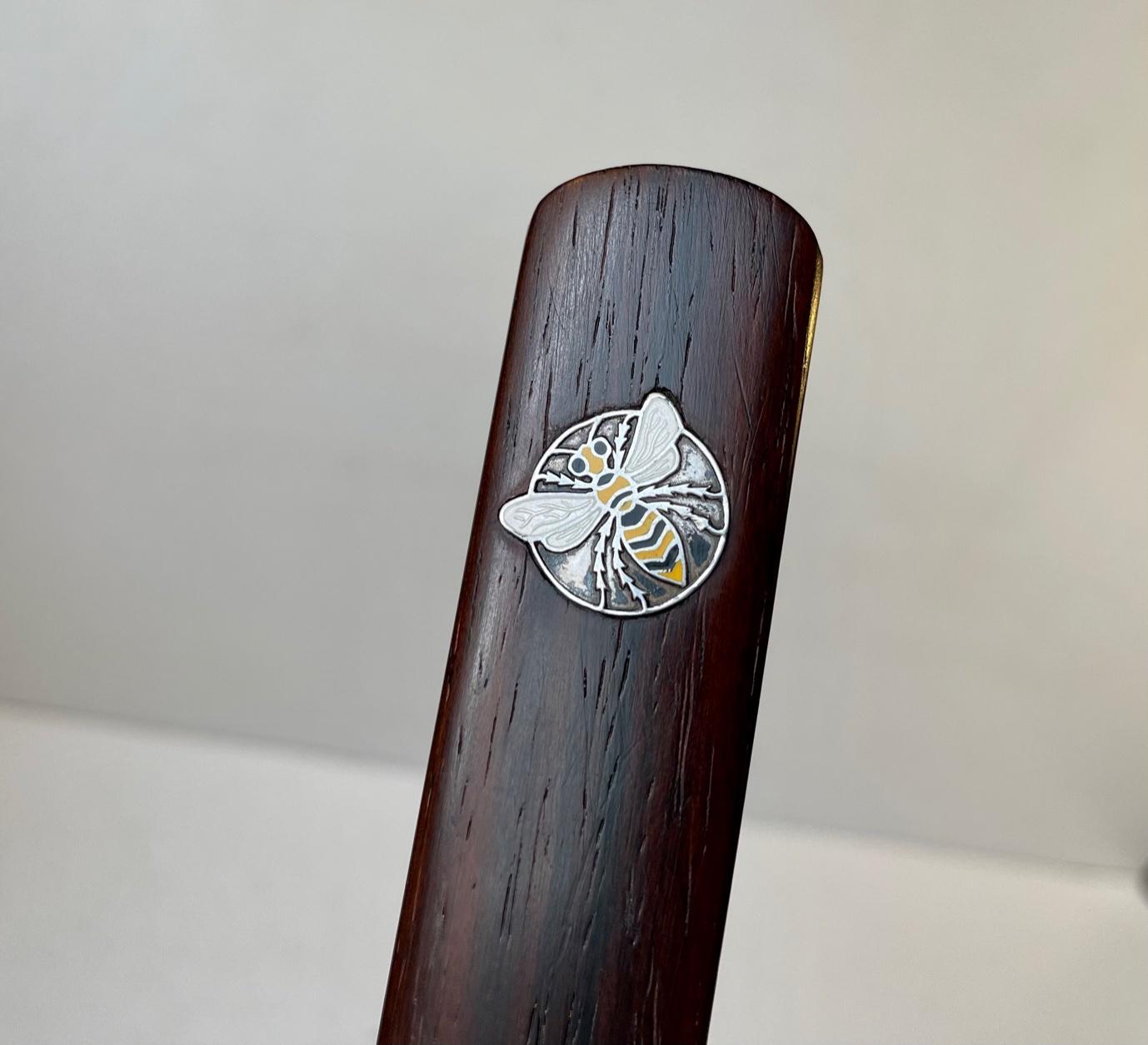 Unique hand-finished letter opener in solid rosewood. It has an inlaid silver and enamel plakette with a bee. It was made by silversmith Hans Hansen in Denmark between 1950-60. Due to Cites regulations this item will only be sold within the EU.