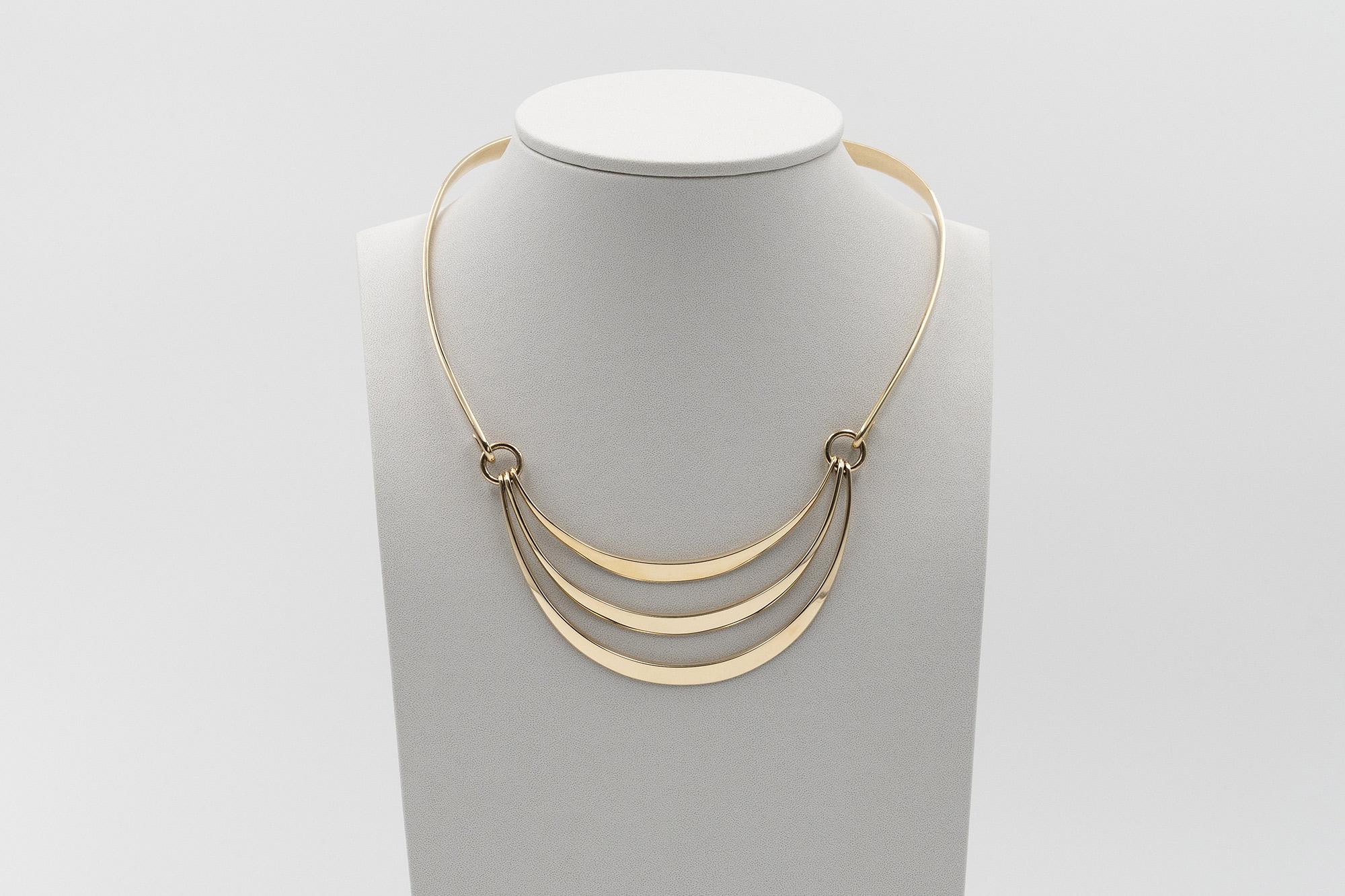 A  14ct gold openable rigid necklace with three articulated elements designed by Danish manufacture 
