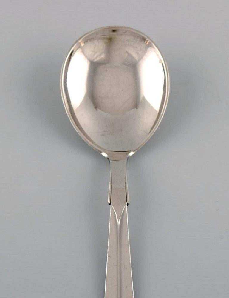 Hans Hansen silverware no. 7. 
Art Deco jam spoon in silver 830. 
Dated 1936.
Measure: Length: 15 cm.
In excellent condition.
Stamped.
Our skilled Georg Jensen silversmith/goldsmith can polish all silver and gold so that it appears new. The